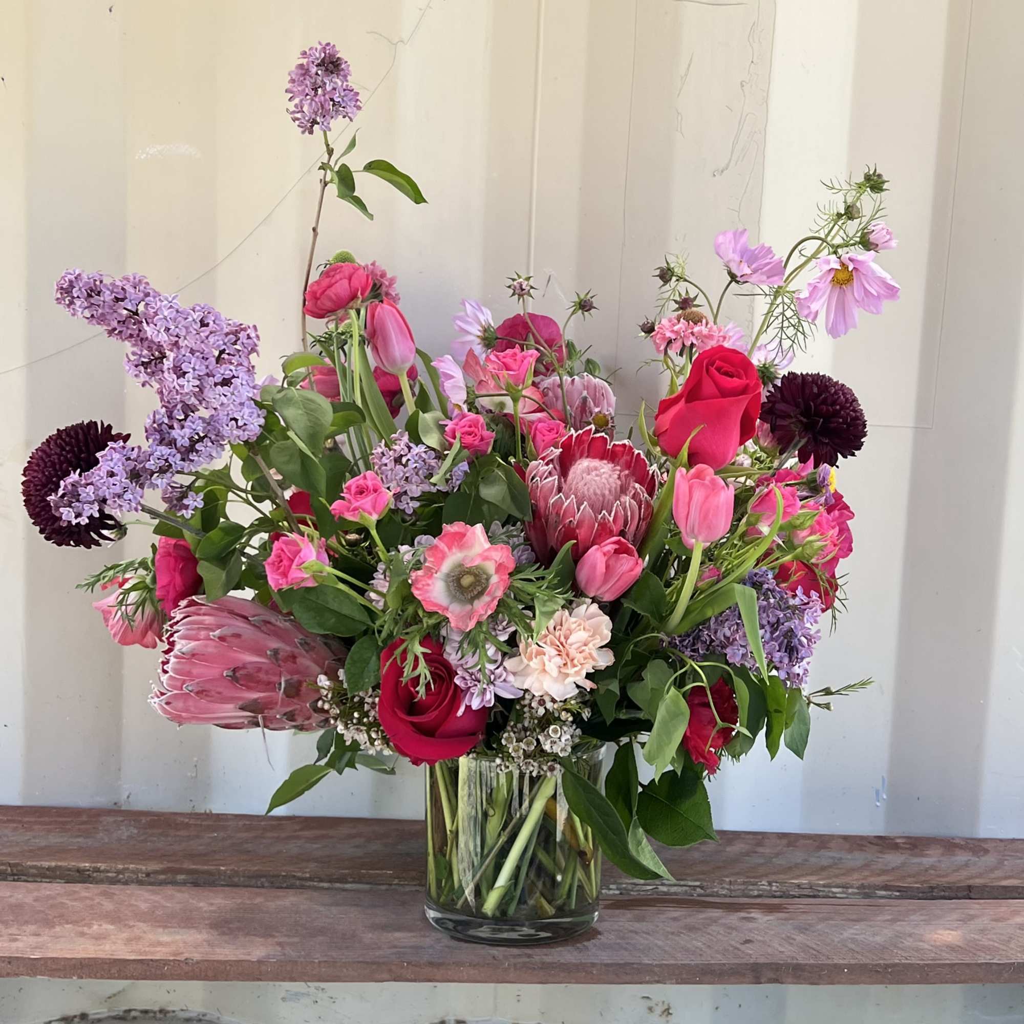Bursting with color and natural elegance, our Blushing Wild arrangement features a