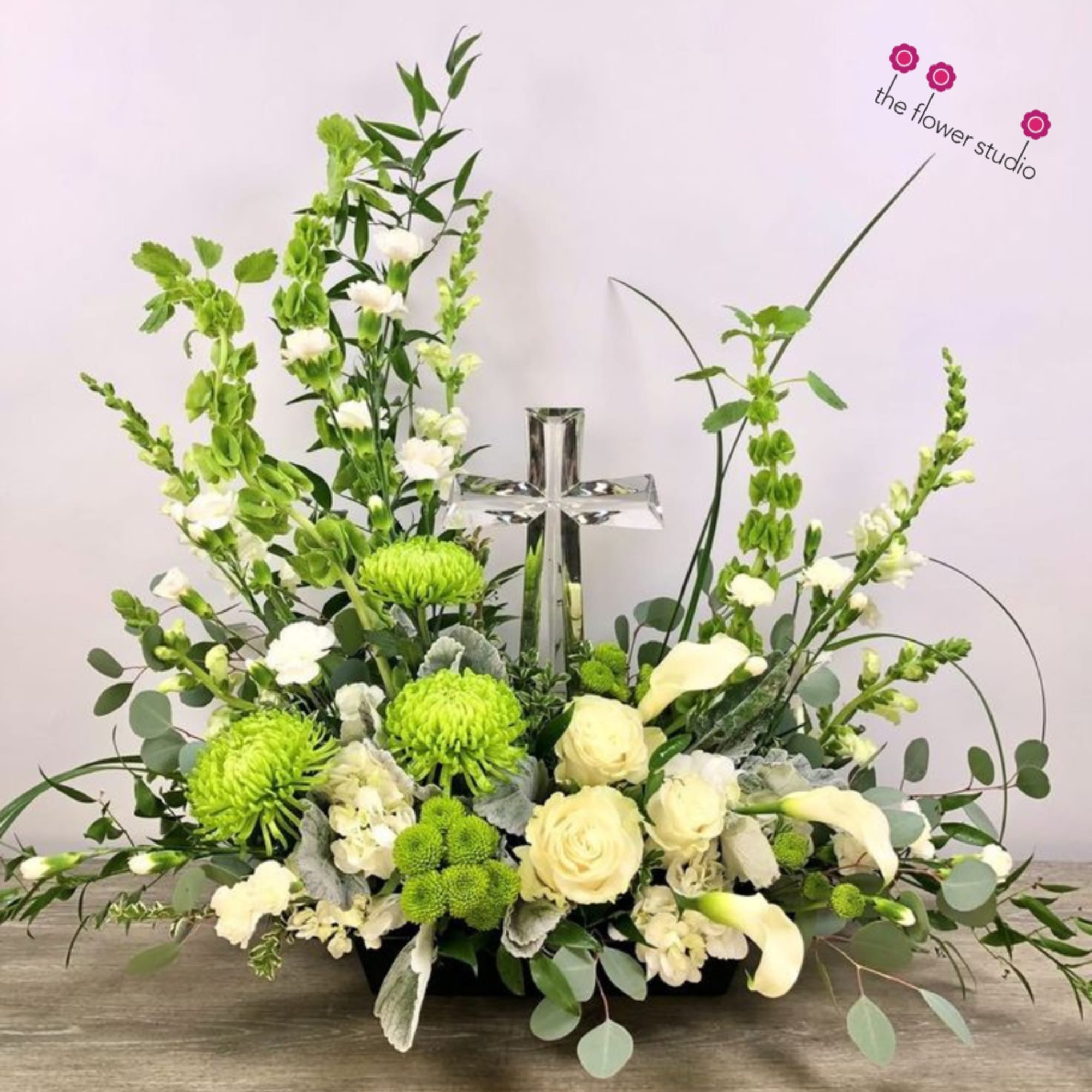 This striking sympathy arrangement combines soothing blues and crisp whites with a