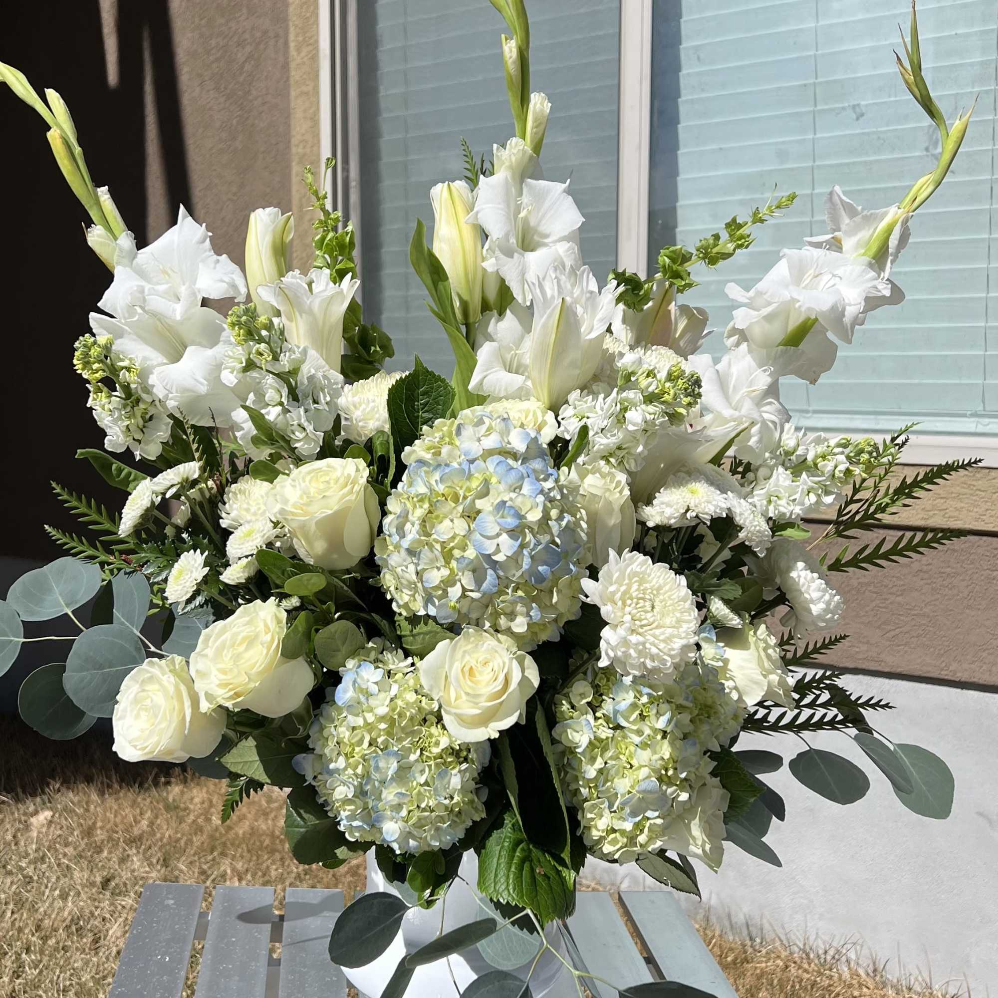 Convey your deepest sentiments with our Peaceful Grace Arrangement, a sophisticated display