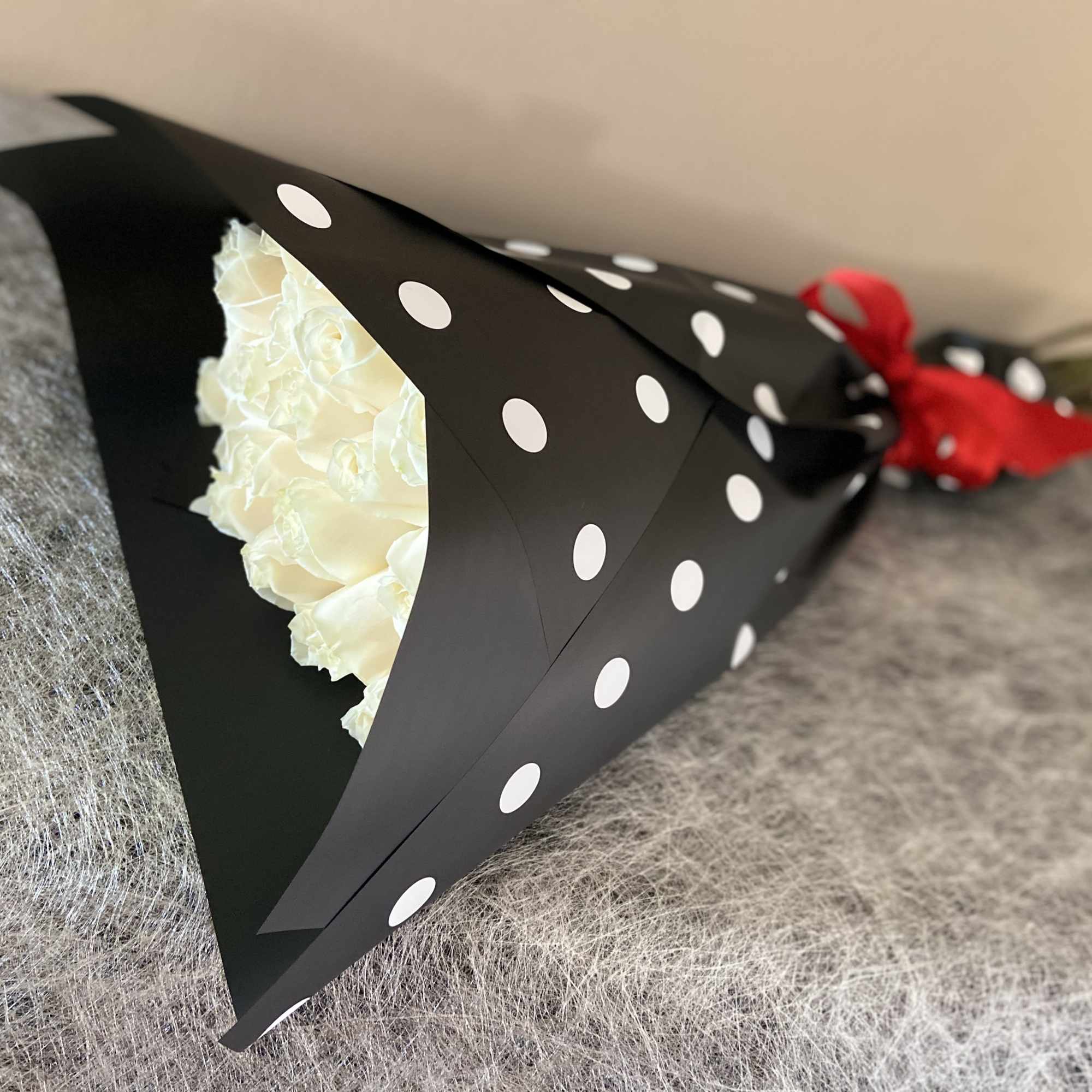 2 Dozen White Roses, Wrapped with Black Paper White Balls, and Red