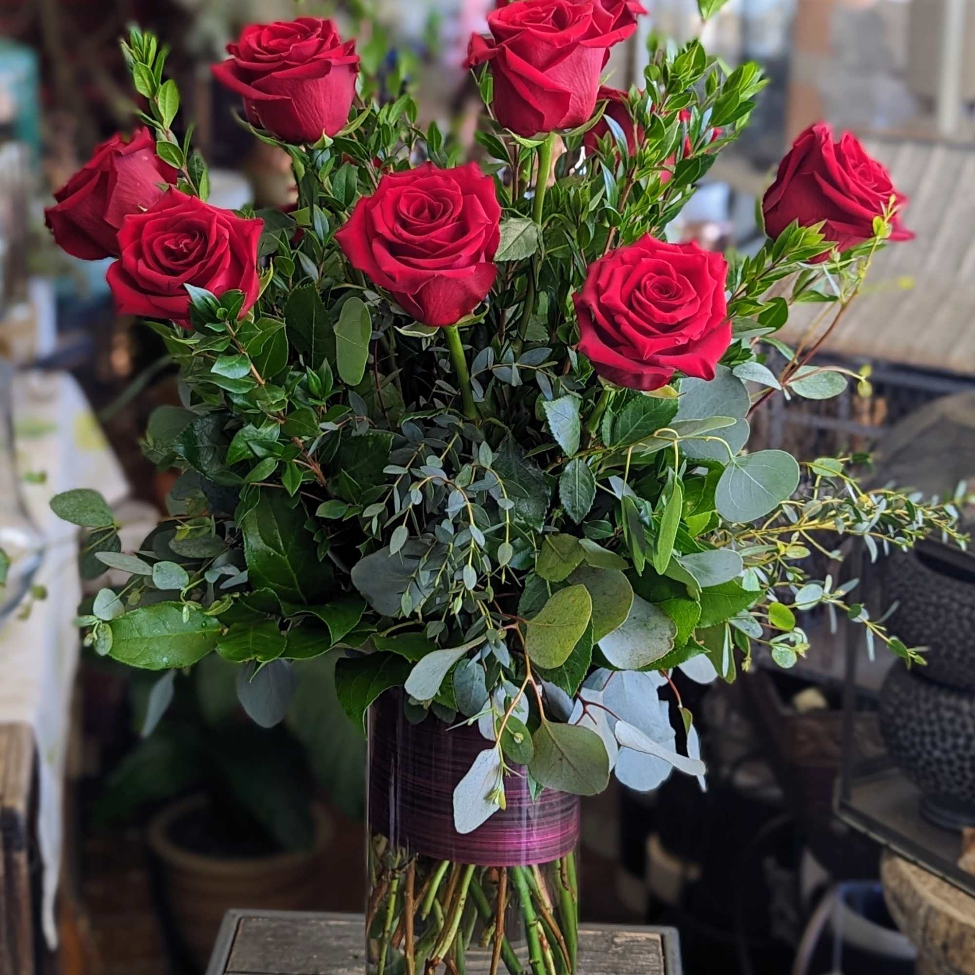 Make a bold romantic statement with this luxurious red rose arrangement from