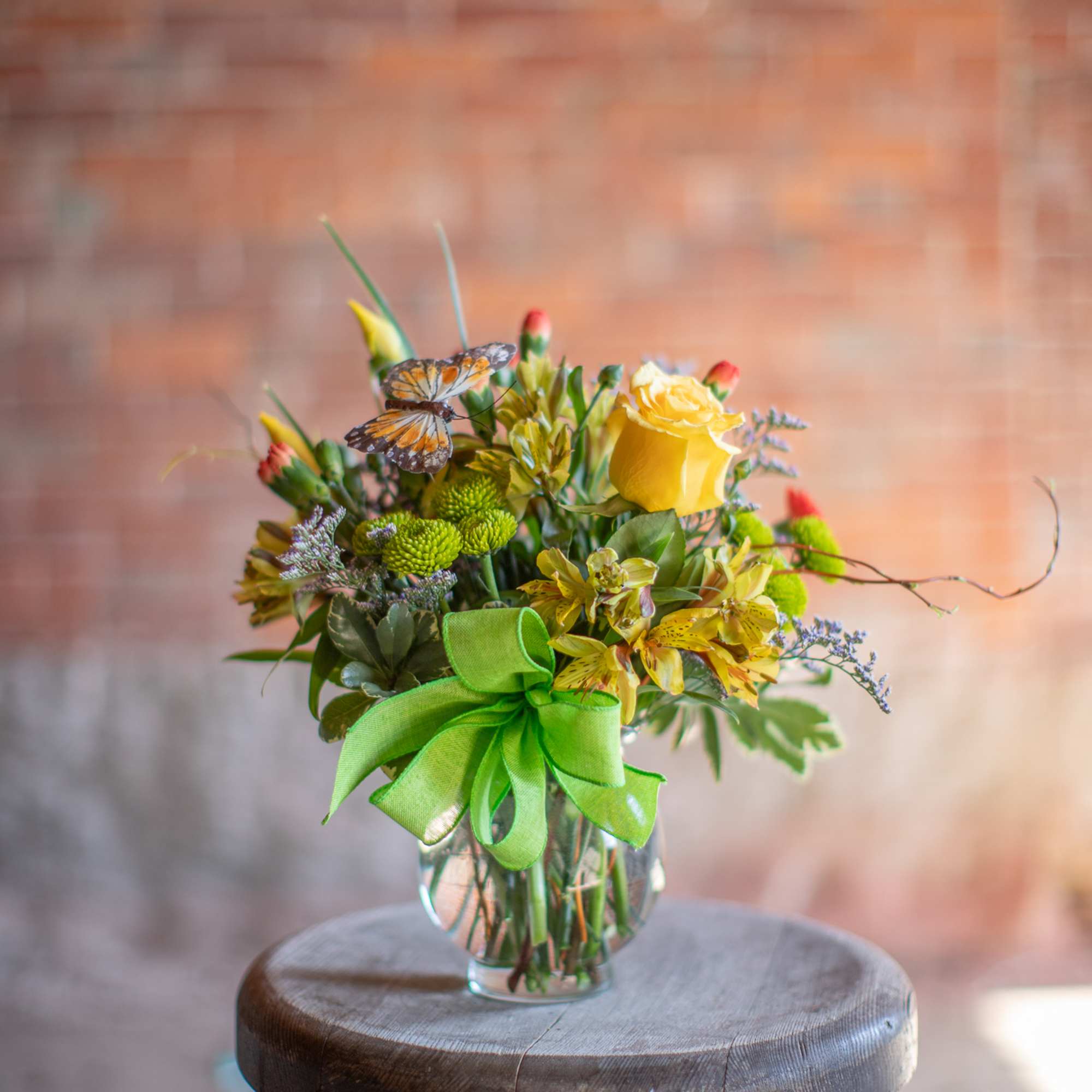 This perky little arrangement is the perfect pick me up! A floral