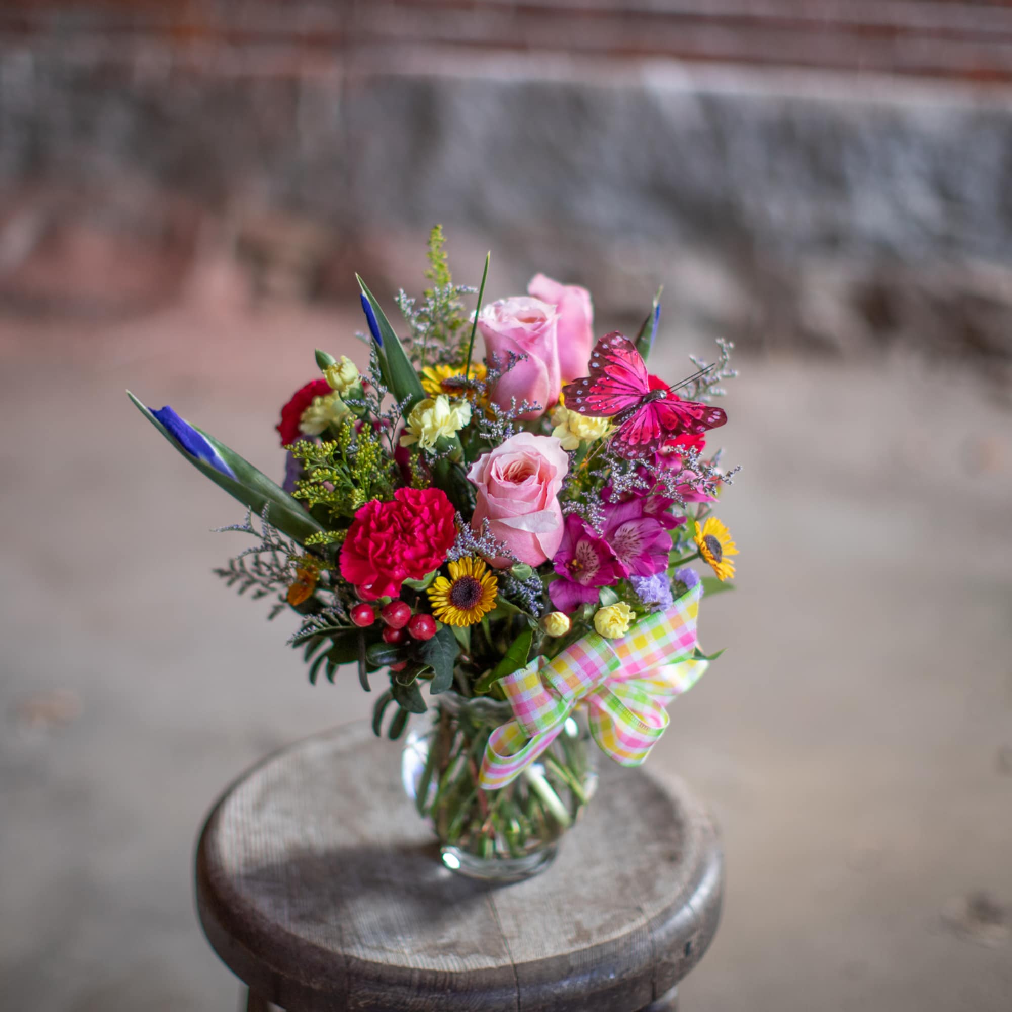 This perky little arrangement is the perfect pick me up! A floral