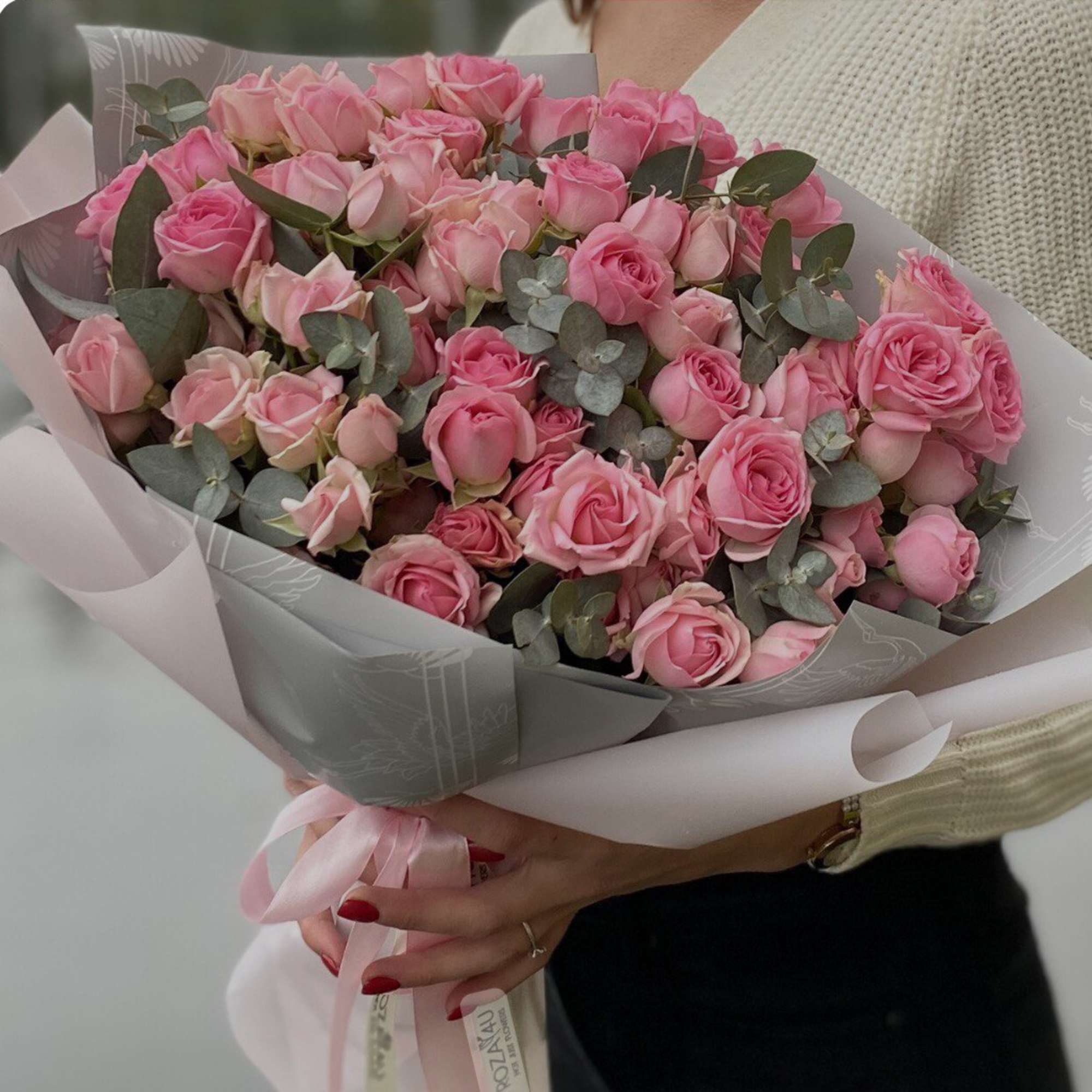 The bouquet includes bright pink roses of different shades and sizes, and The bouquet includes bright pink roses of different shades and sizes, and