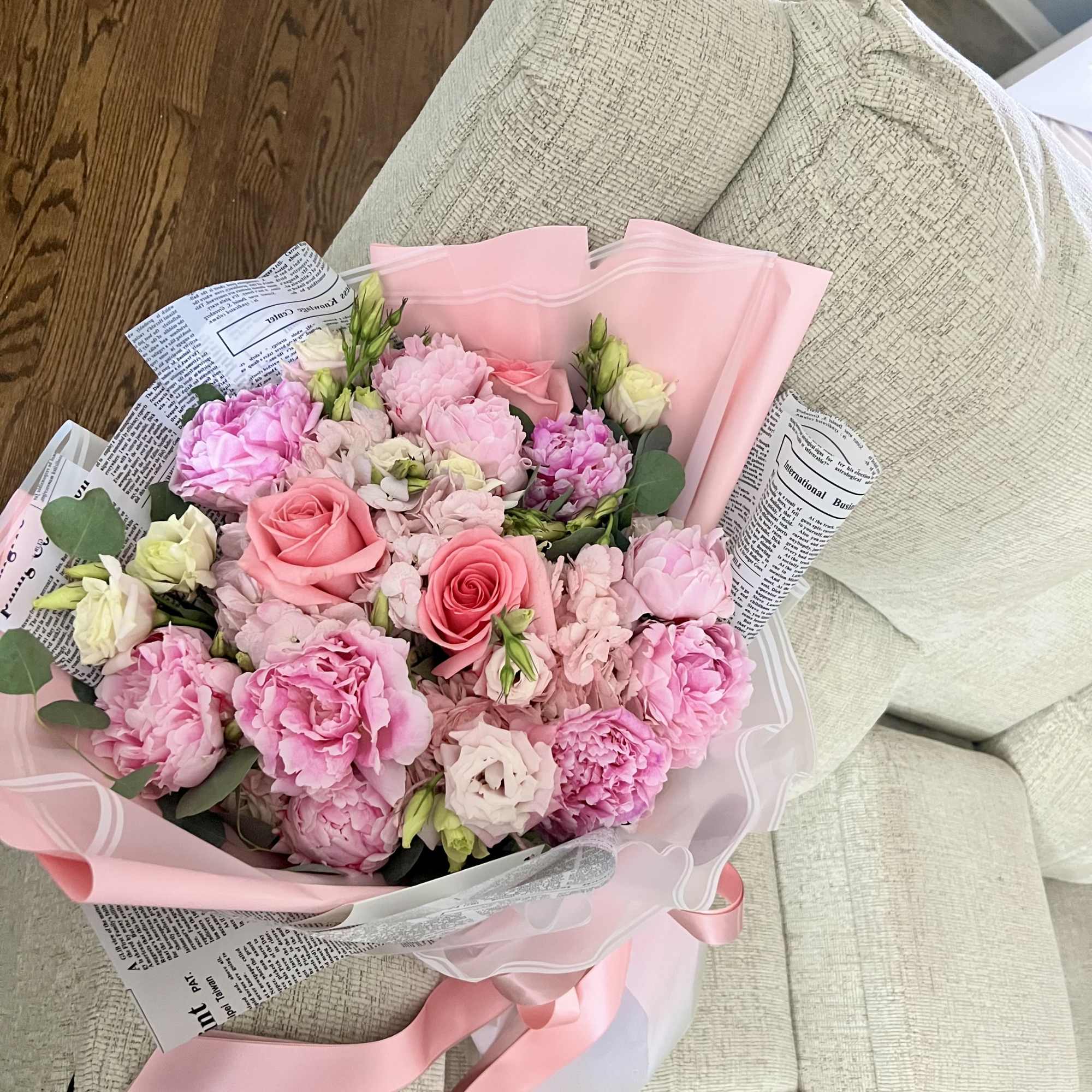 A dreamy blend of light pink peonies, creamy lisianthus, soft hydrangeas, and