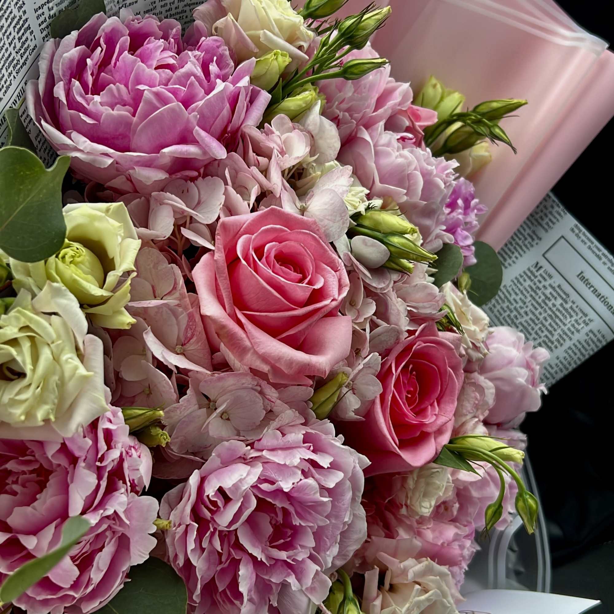 A dreamy blend of light pink peonies, creamy lisianthus, soft hydrangeas, and