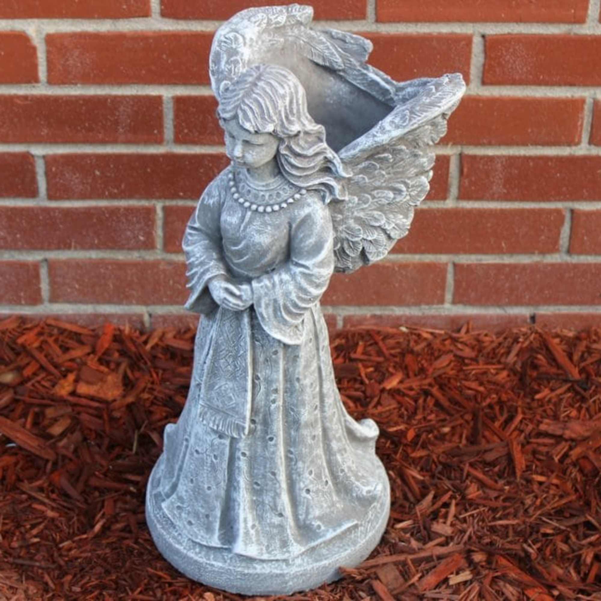 Cement Angel with  planter in the wings.
Approximate Dimensions are 19 1/2