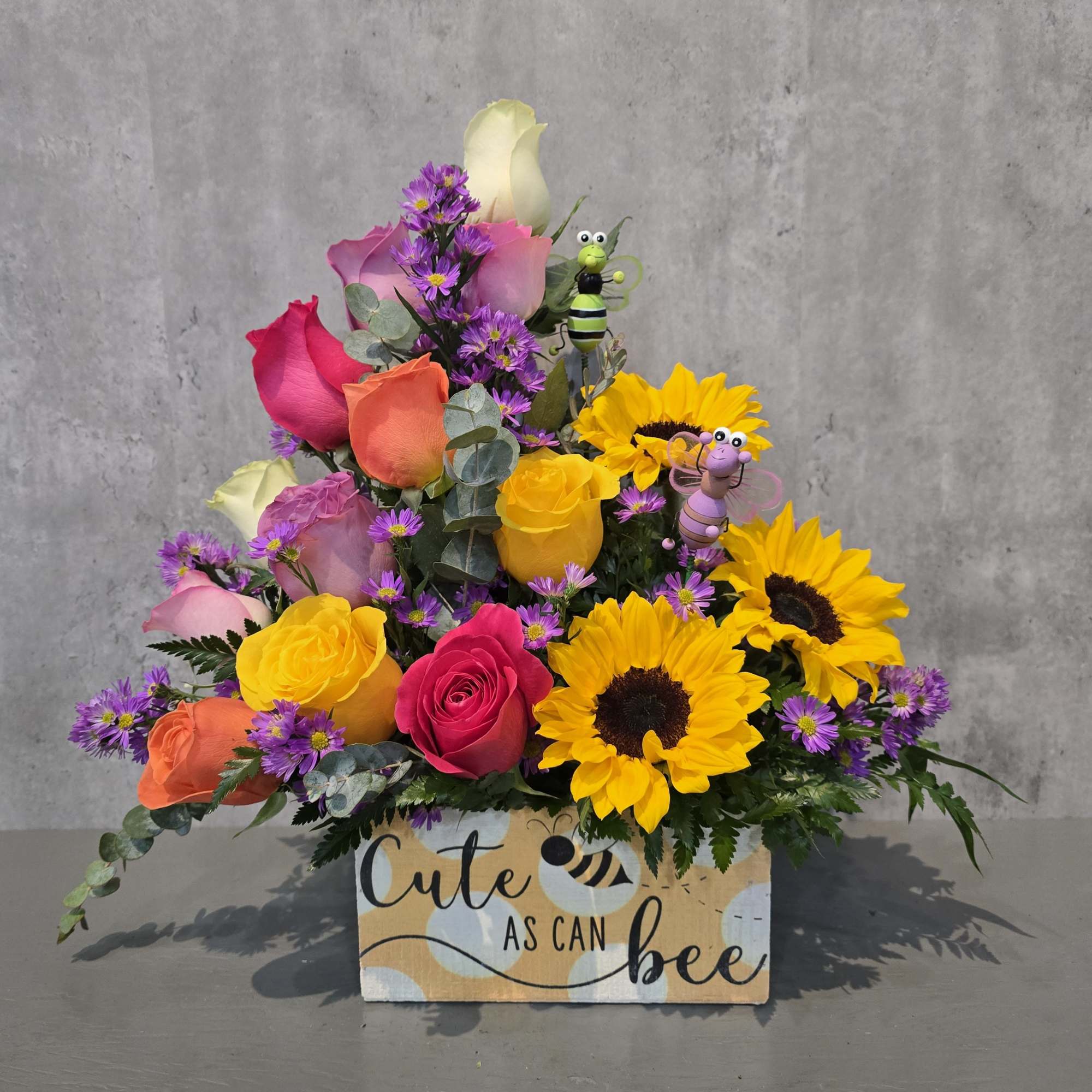 Bee Happy is a cheerful and vibrant floral arrangement designed to bring