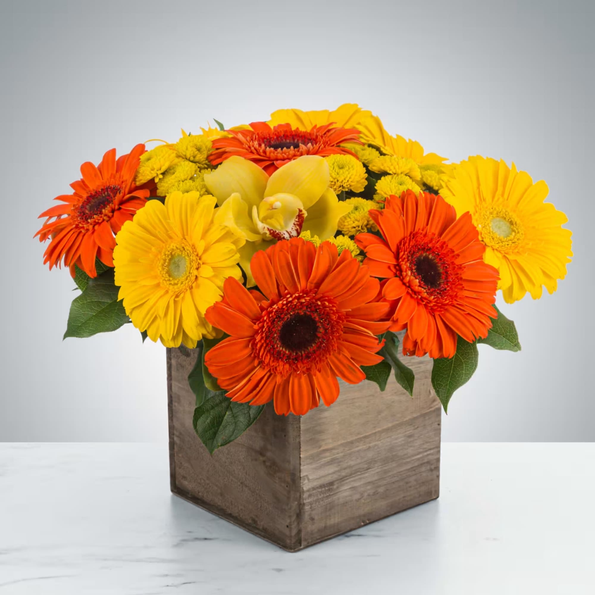 Everybody loves daisies! Send this cheerful wooden box featuring orange and yellow