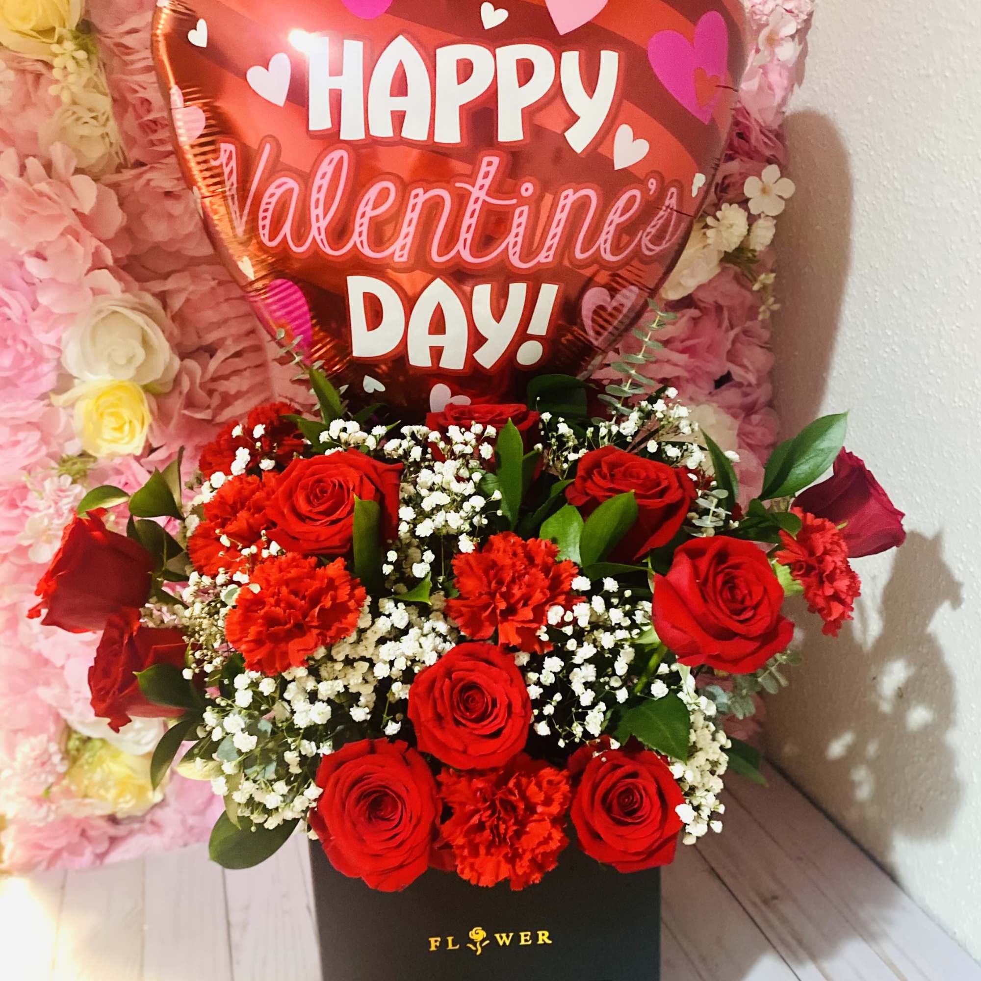 Mix of (12) roses, carnations, greenery &amp; baby breath. With choice of