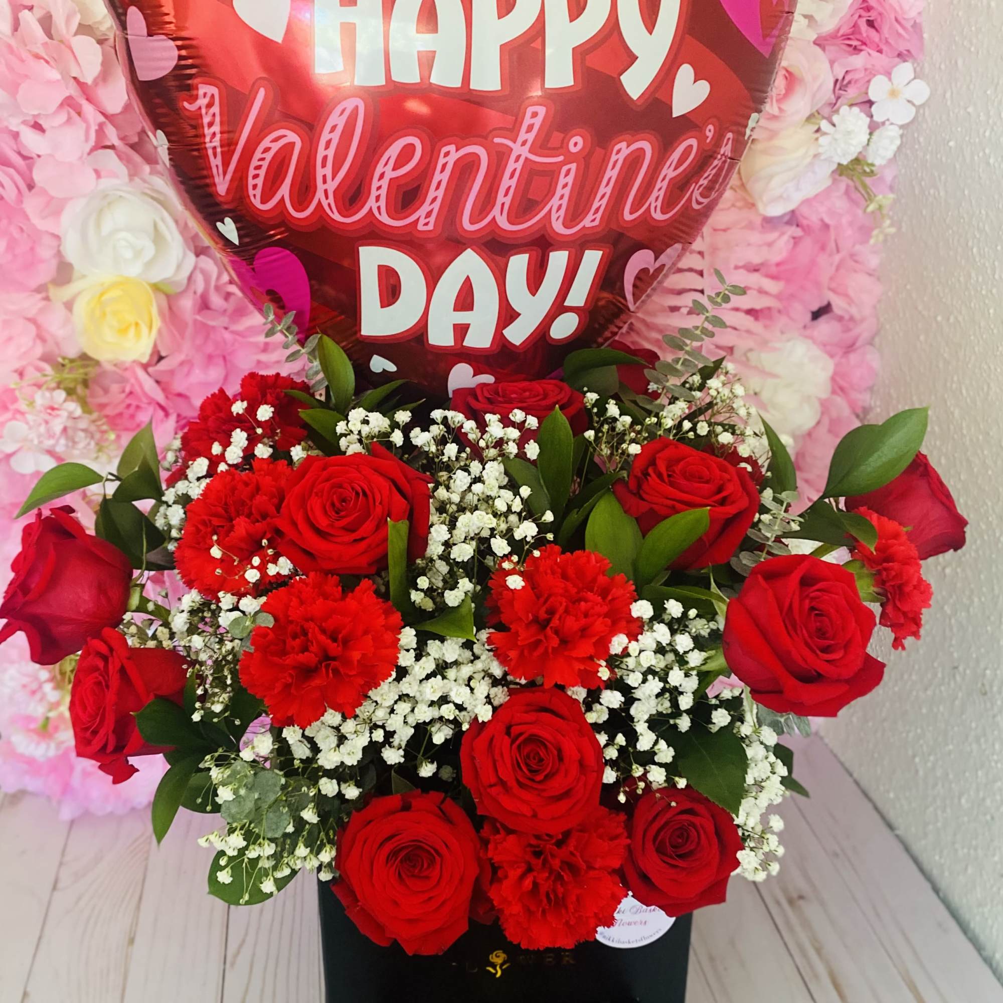 Mix of (12) roses, carnations, greenery &amp; baby breath. With choice of