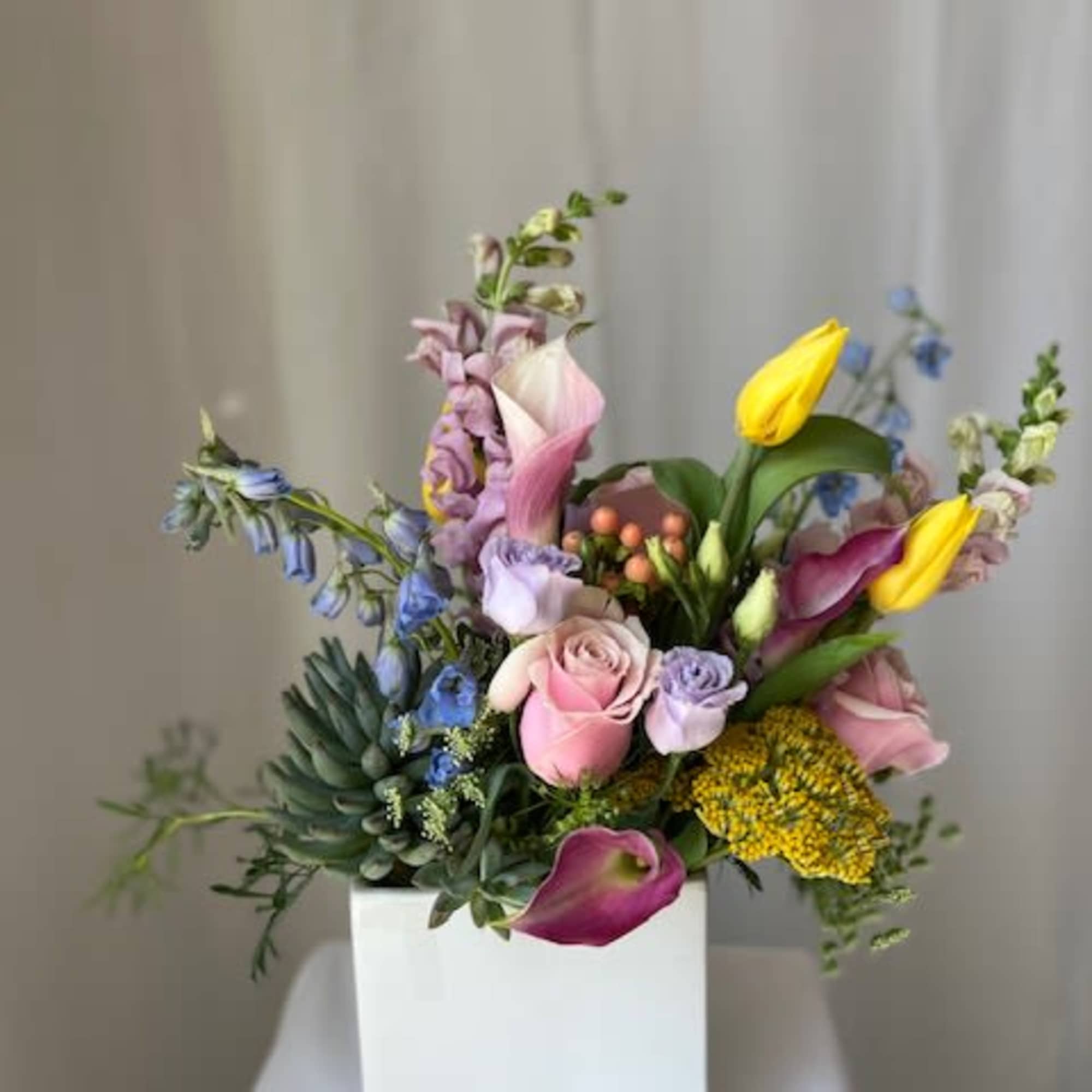 This arrangement is perfect for a plant and flower lover combined! We This arrangement is perfect for a plant and flower lover combined! We