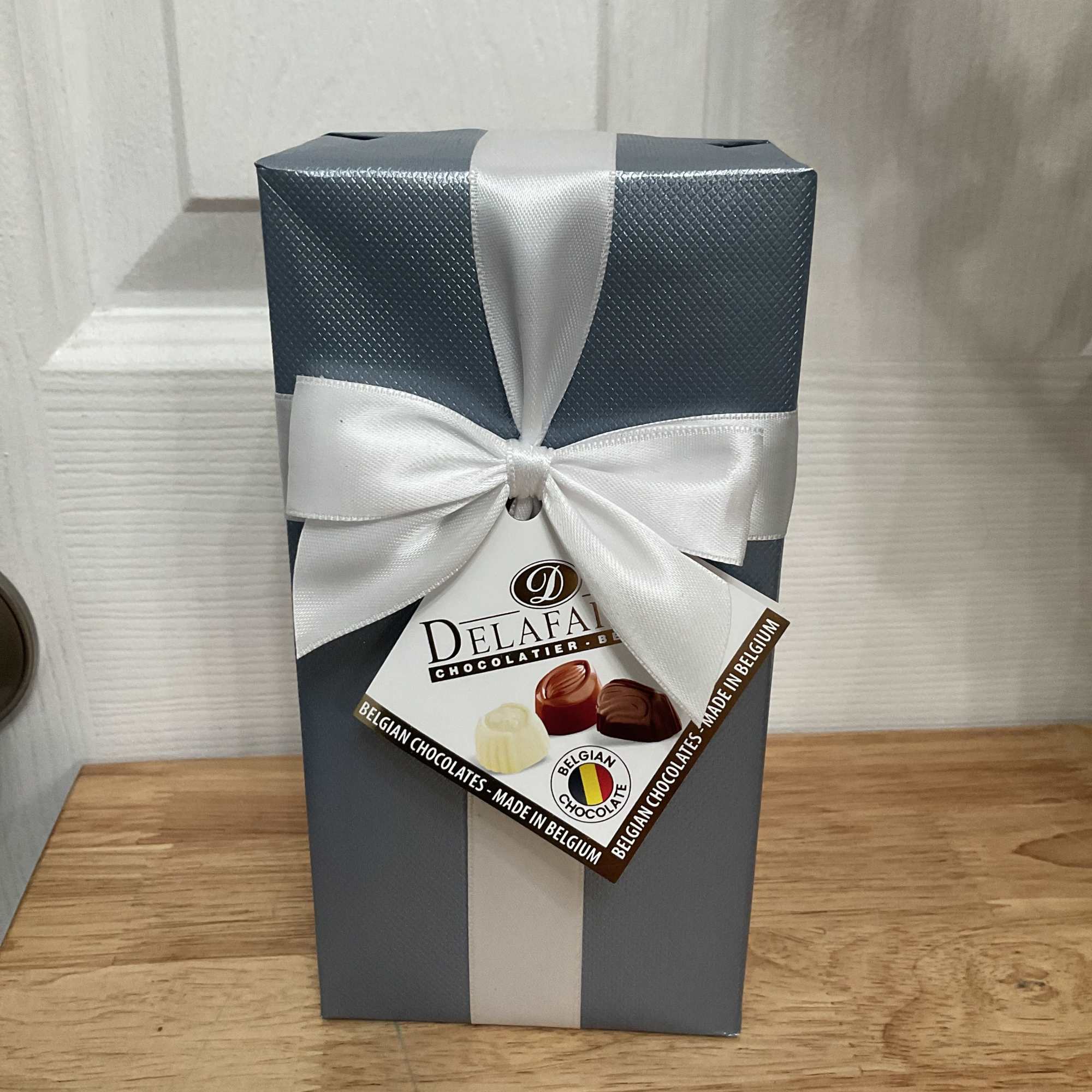 Large spring bouquet in a vase with several varieties of flowers to