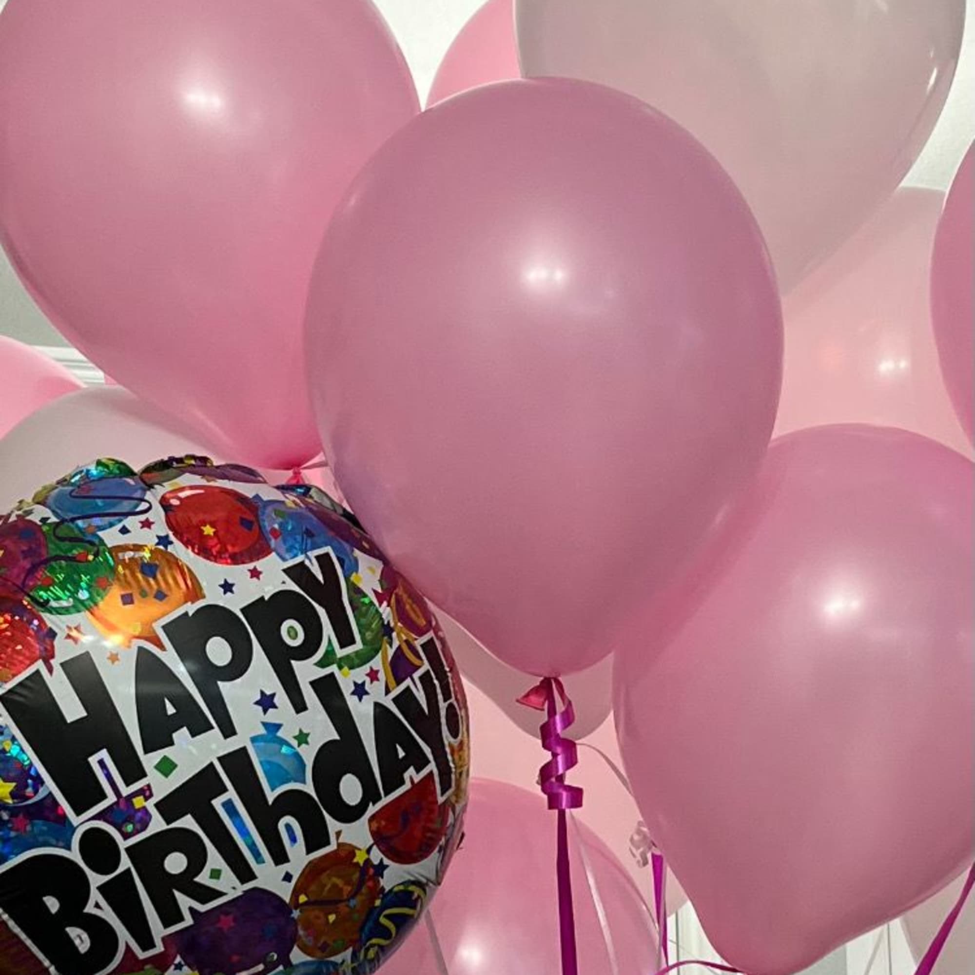 Large spring bouquet in a vase with several varieties of flowers to