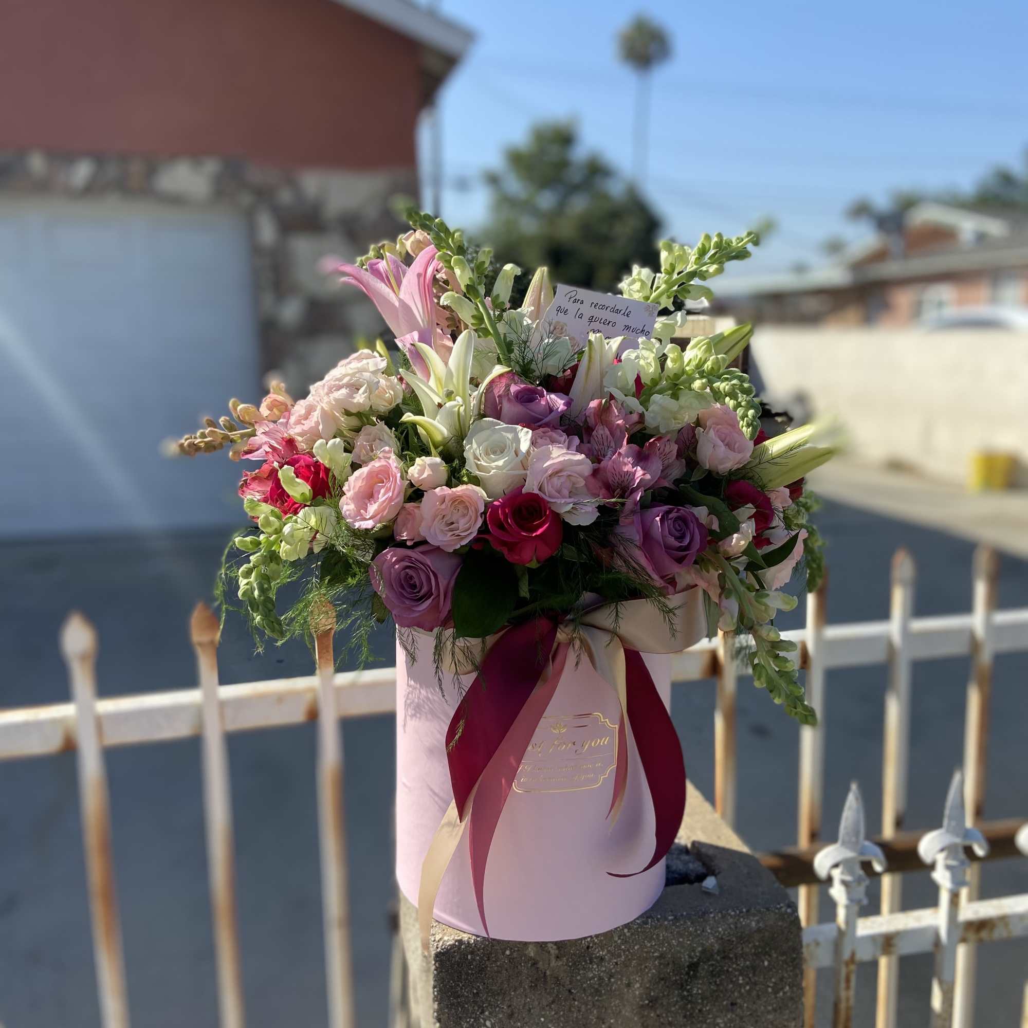 Lilies, Roses. Spray Roses and Snap Dragon Cylinder Box