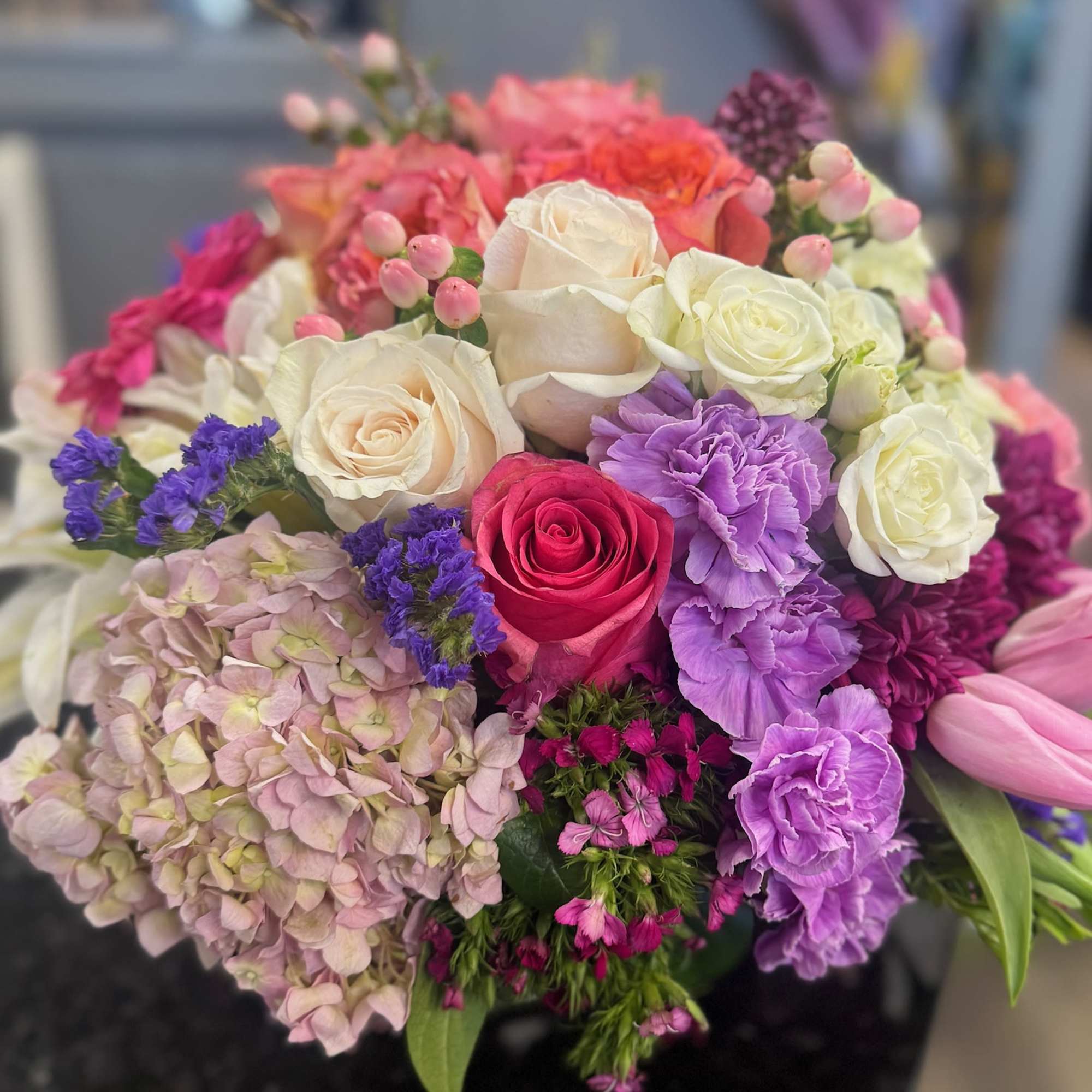 Seasonal flowers designed in vase with greenery and filler.  Seasonal flowers designed in vase with greenery and filler.