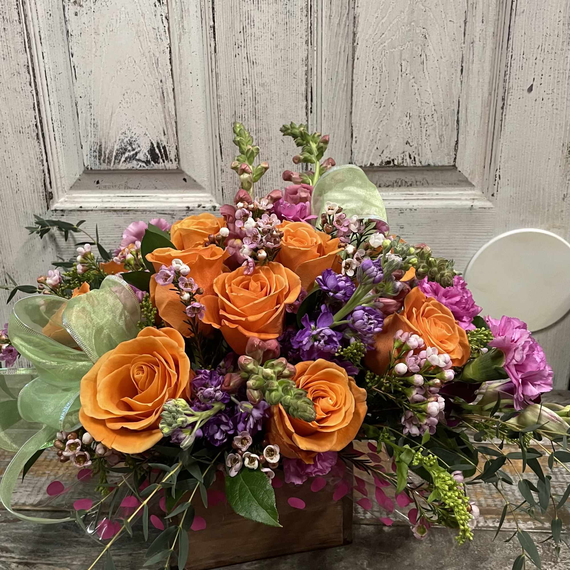 Keep things fun with a unique flower box full of bright roses