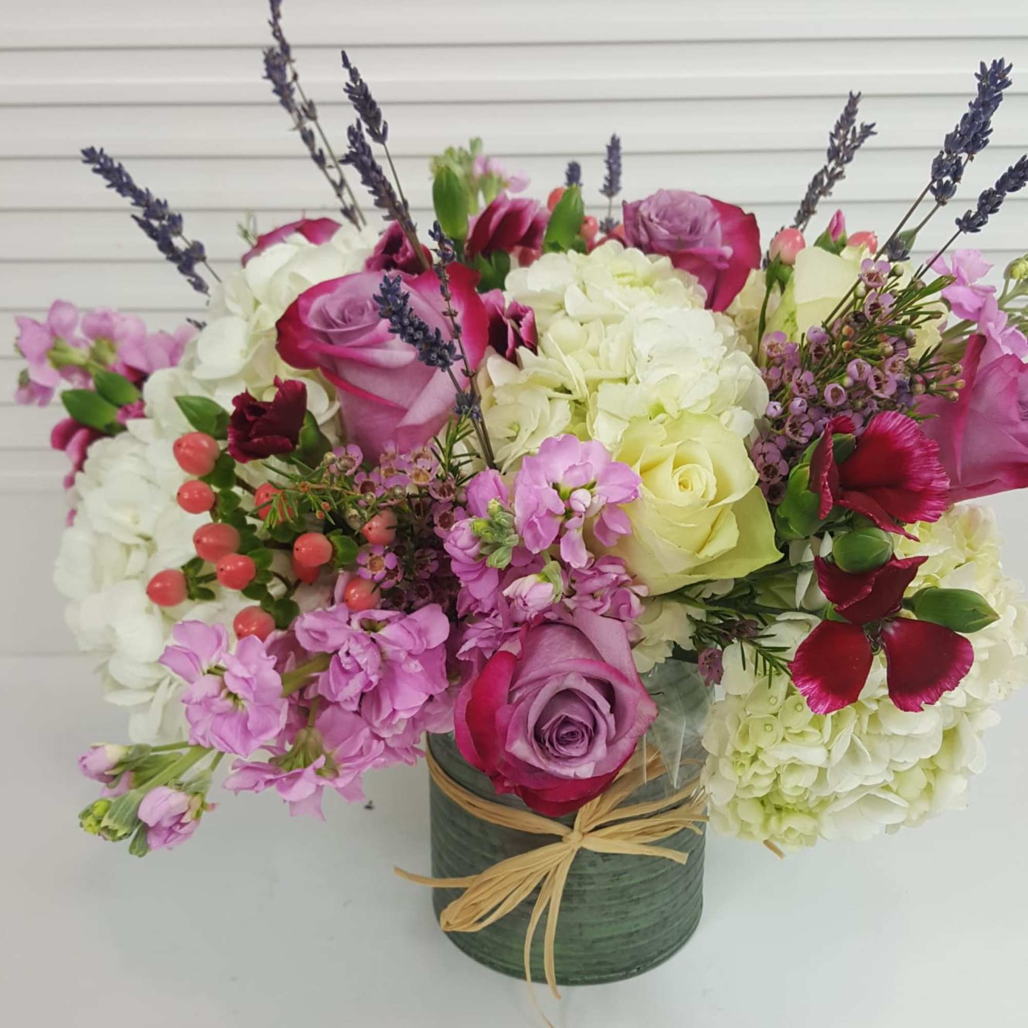 Collection of Hydrangea, Spray Roses, Seeded Eucalyptus,Lavender,  decorative pompoms, In an