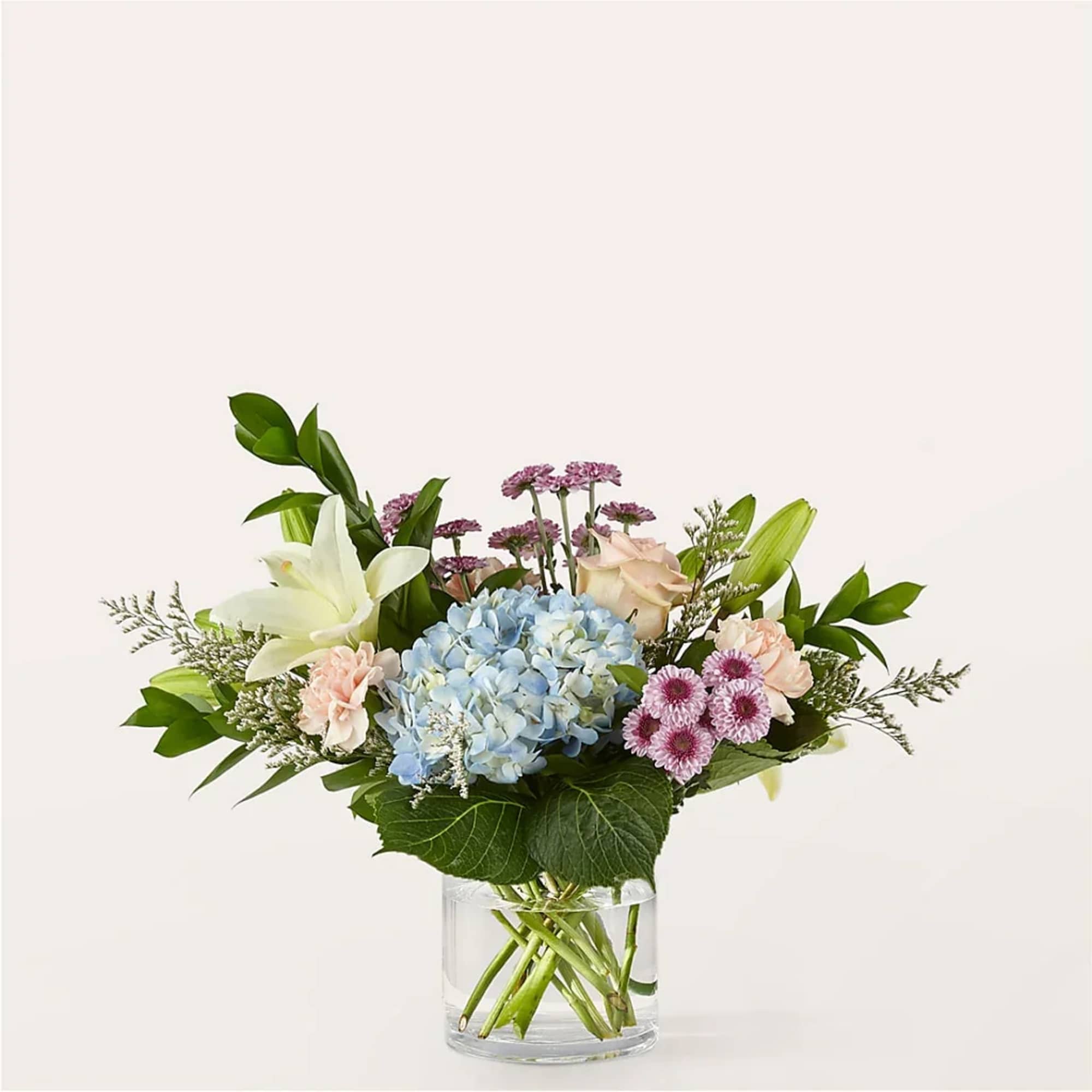 Unwind with the gentle and healing colors of this arrangement featuring dreamy