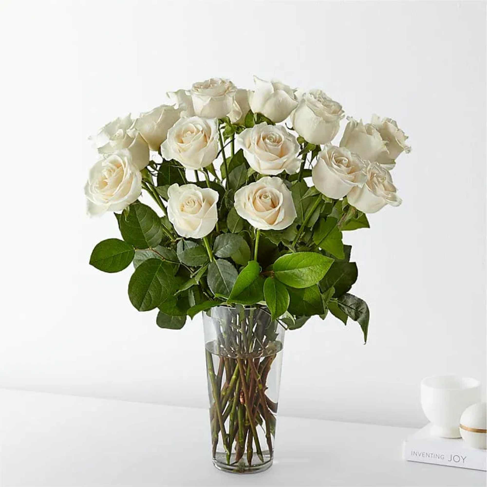 White roses are elegant, luminous, and beautifully accent any room. With a