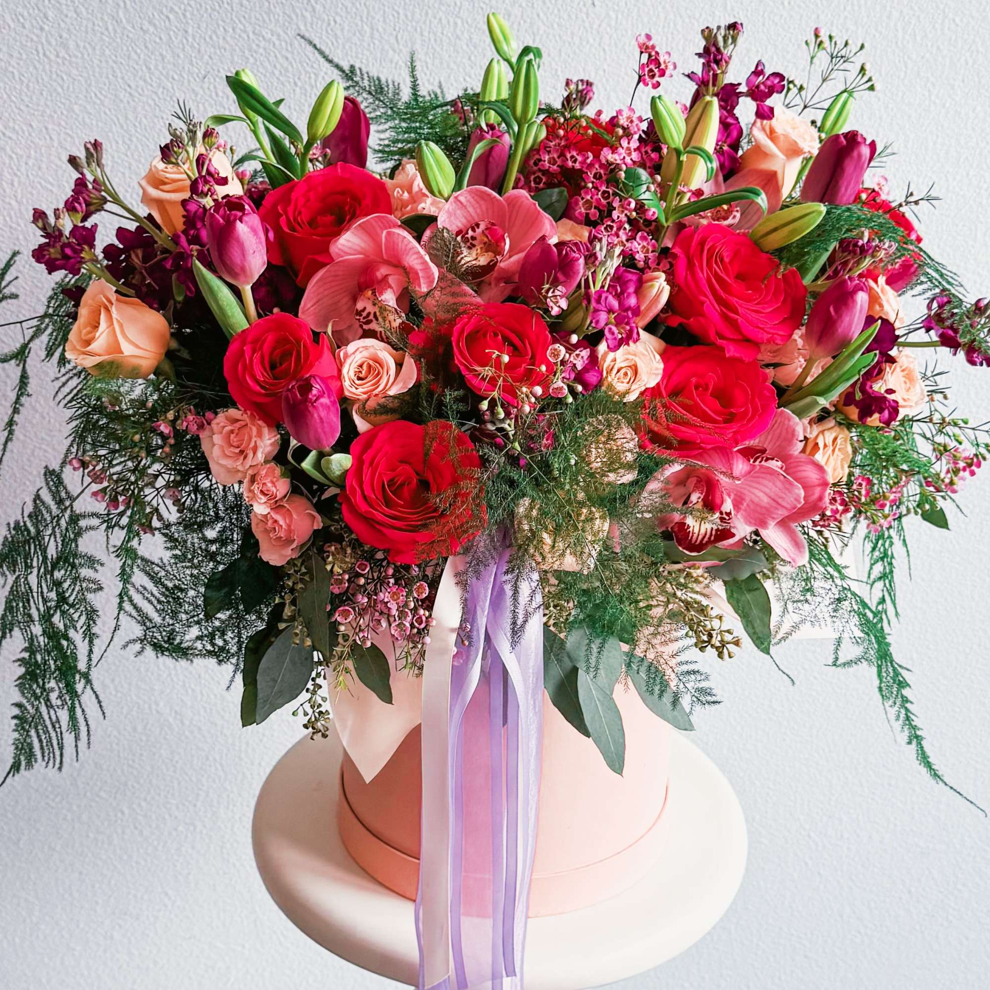 This bouquet is a total showstopper! With its fiery red roses, soft This bouquet is a total showstopper! With its fiery red roses, soft