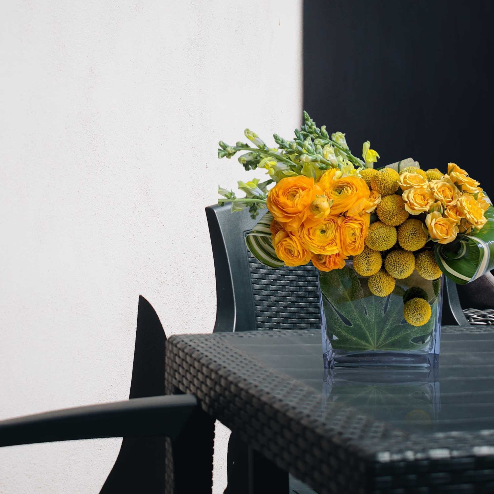 This petit vase is overflowing with a summer mix of fine flowers.