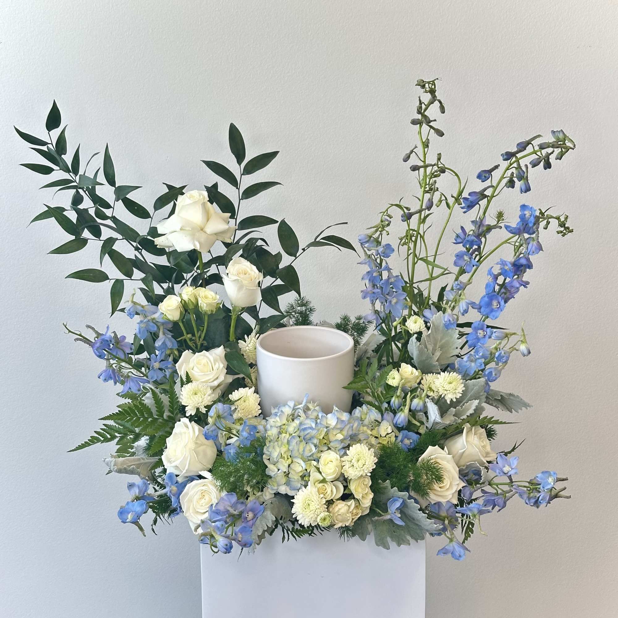 The &quot;Clear Skies Urn Meadow&quot; is a serene and evocative tribute, crafted
