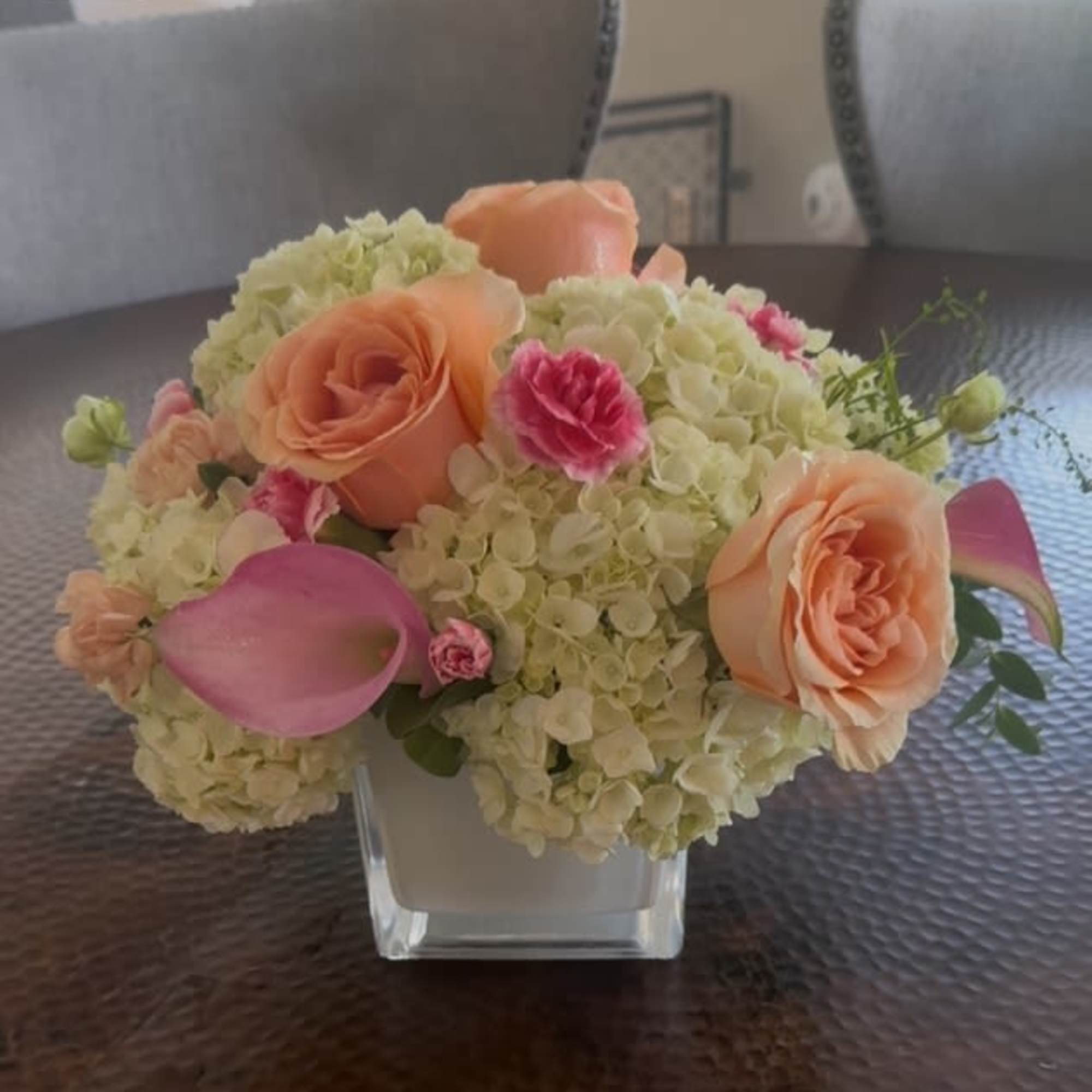 Brighten someone's day with this cheerful bouquet. This arrangement includes roses and Brighten someone's day with this cheerful bouquet. This arrangement includes roses and
