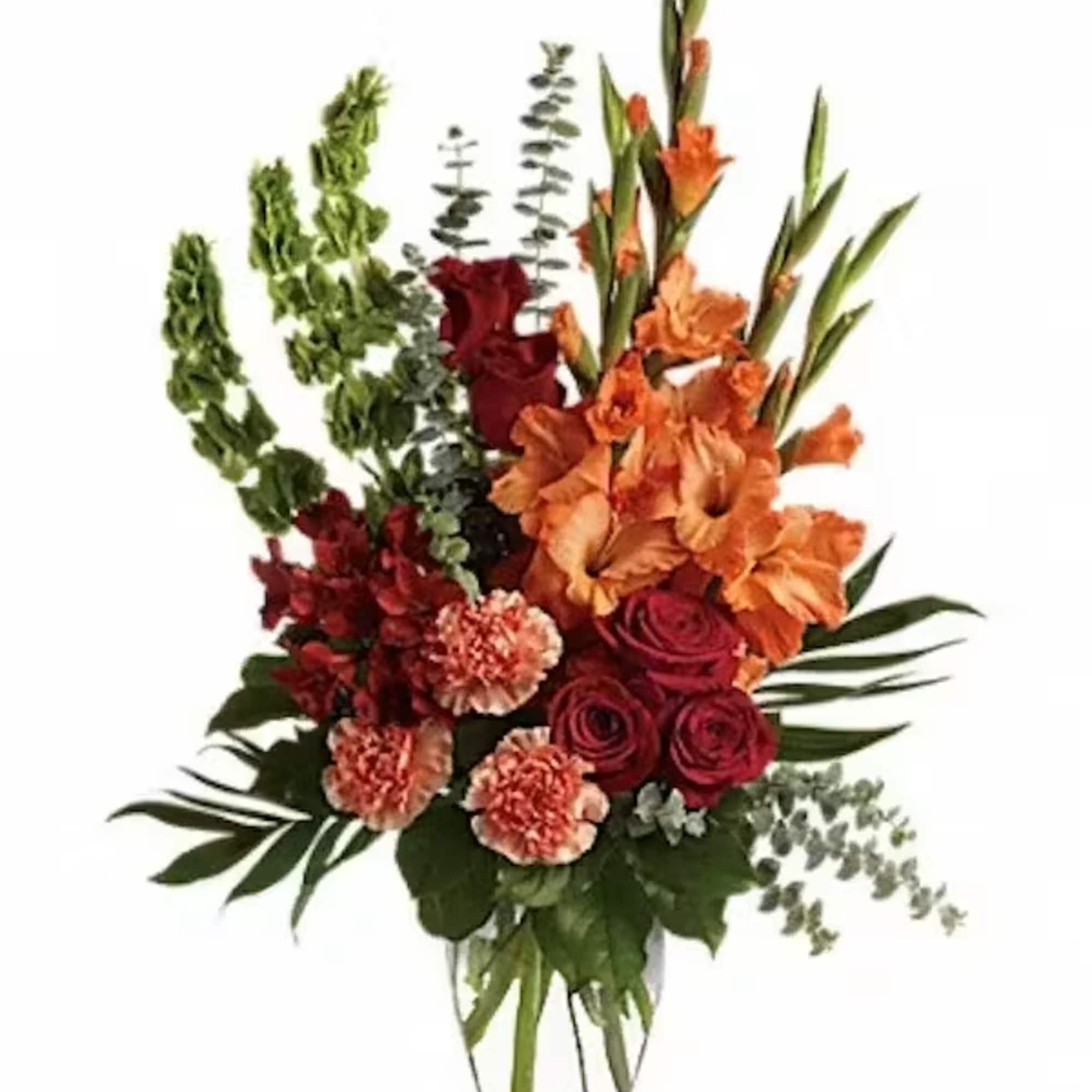 The brilliant arrangement includes red roses, red alstroemeria, orange gladioli, orange carnations