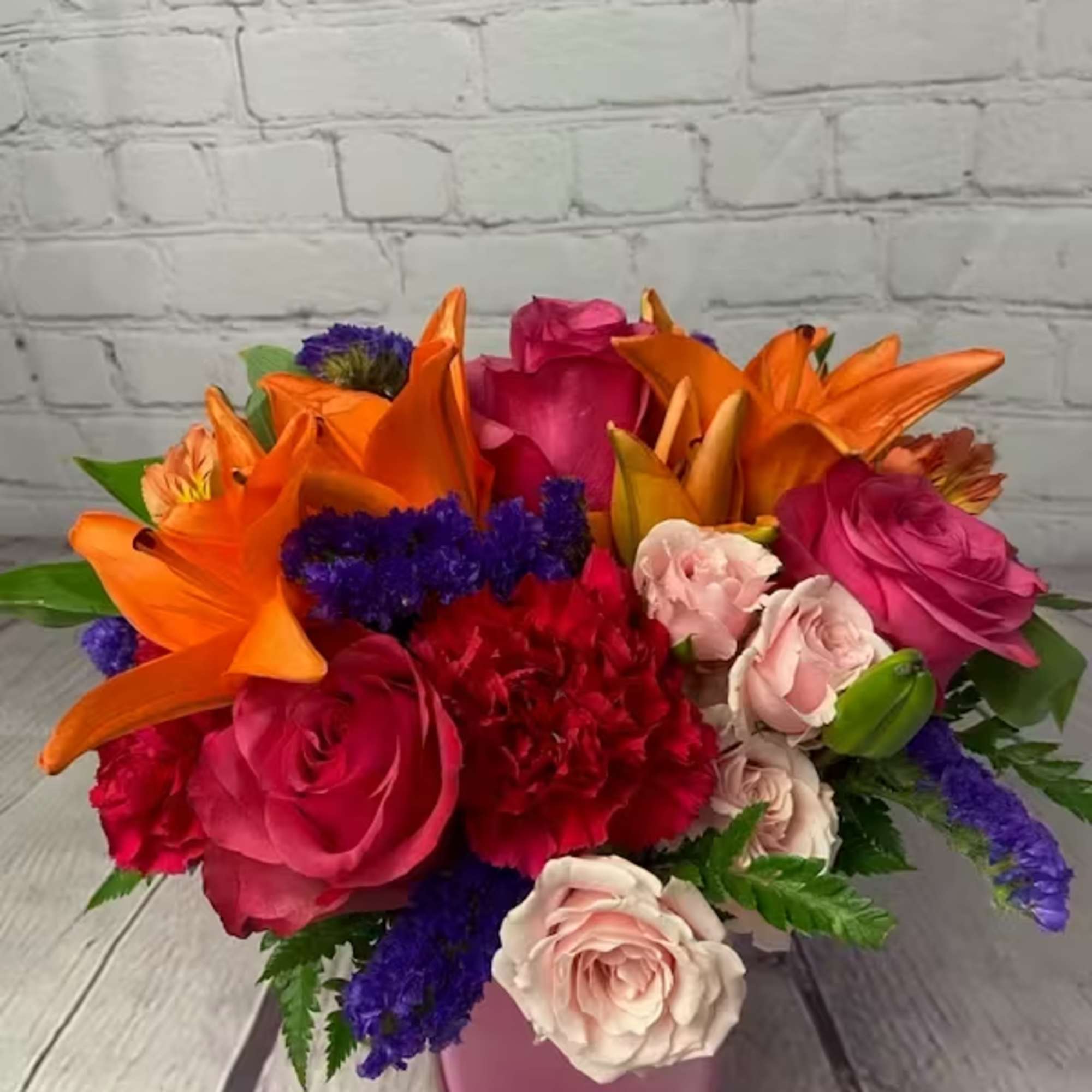 This fresh, fun mix of pink roses, peach asiatic lilies, peach alstroemeria