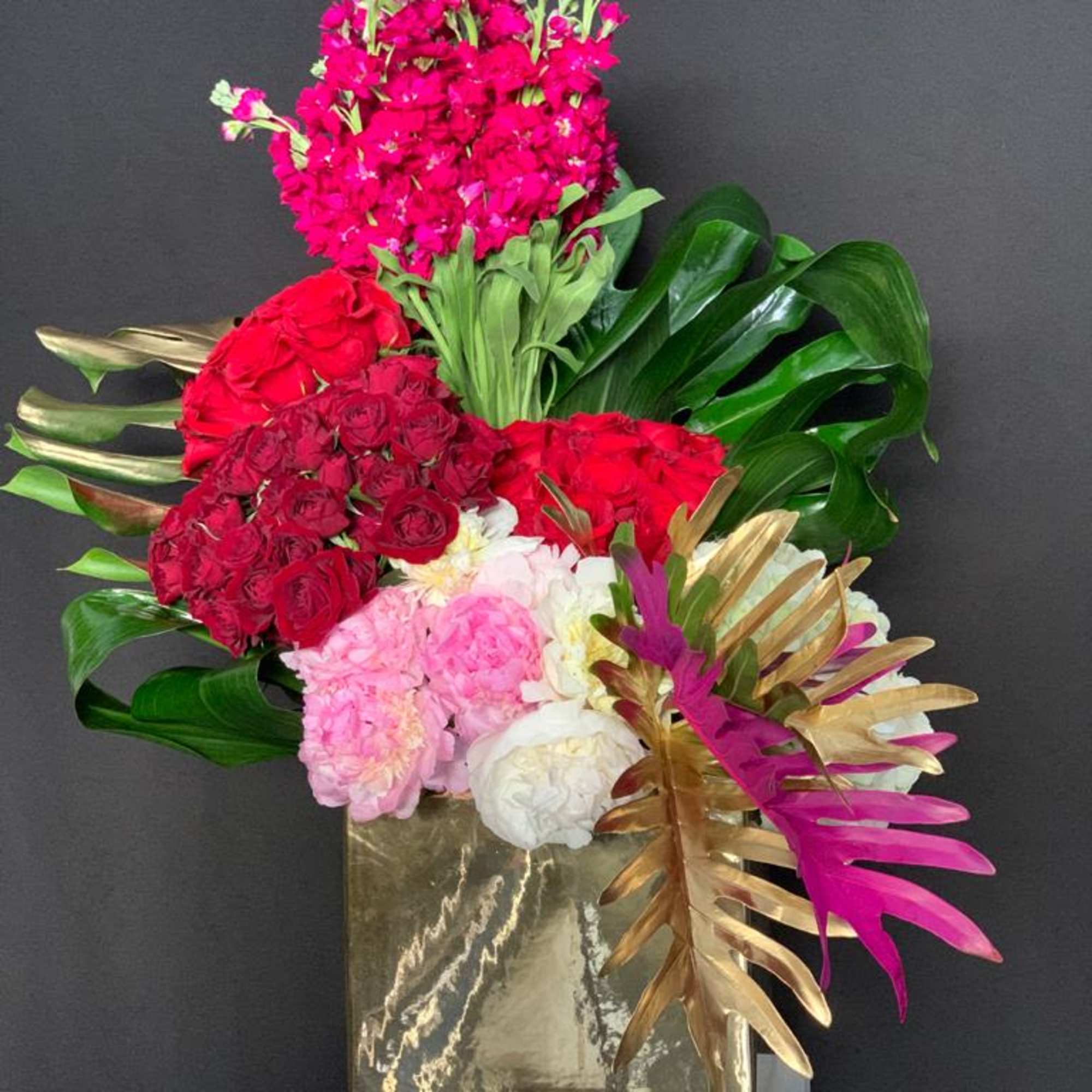 Discover the beauty of our Mixed Red Roses, Hydrangeas, and Peonies Flower