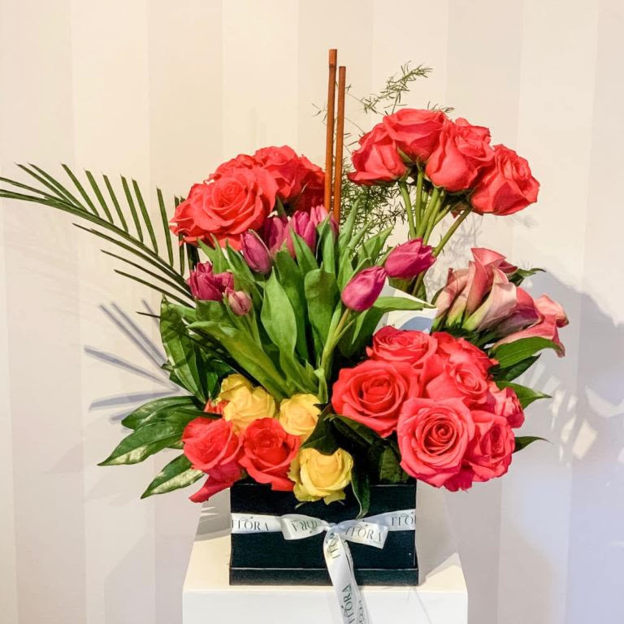 Charming small bloom box arrangement featuring a variety of fresh flowers. Perfect