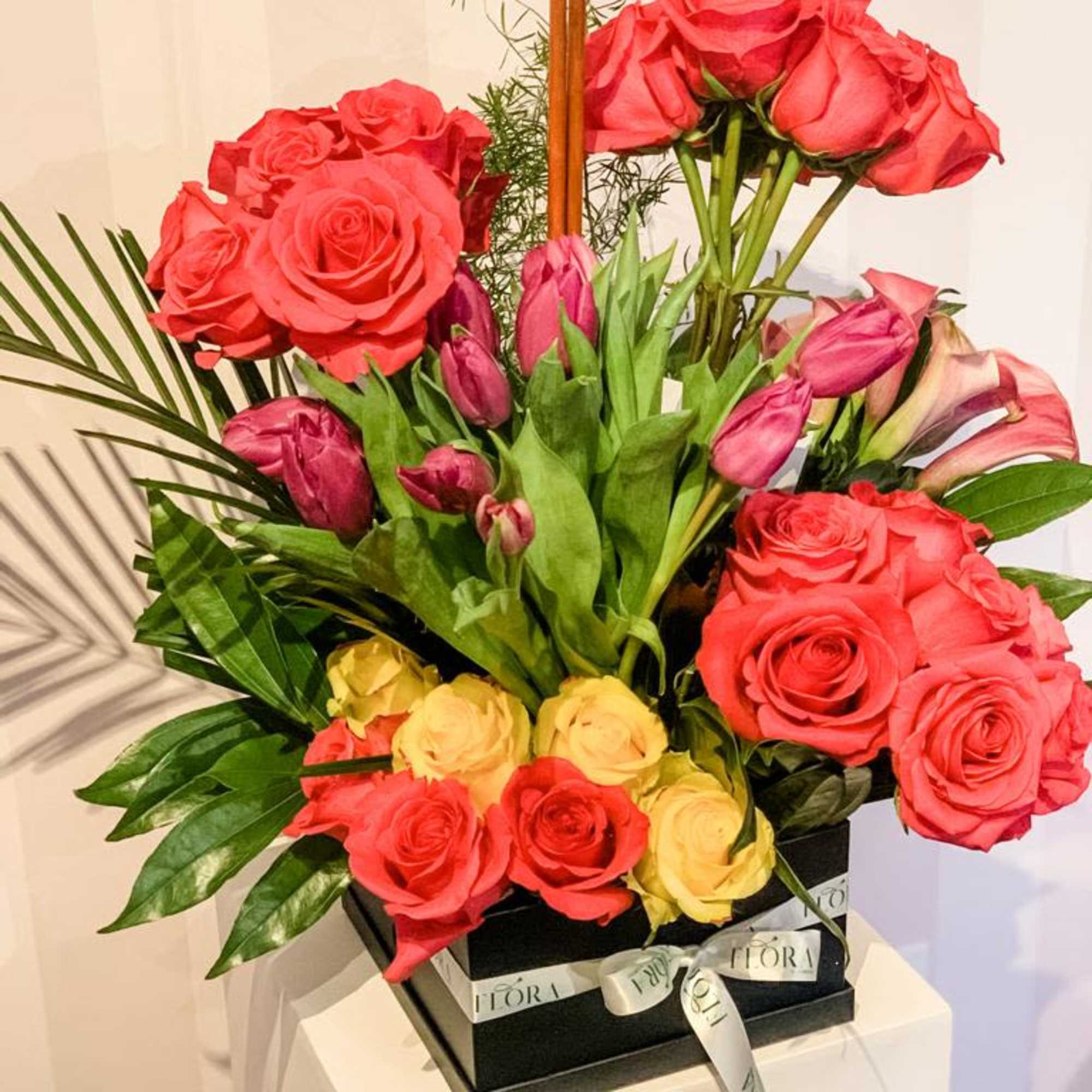 Charming small bloom box arrangement featuring a variety of fresh flowers. Perfect