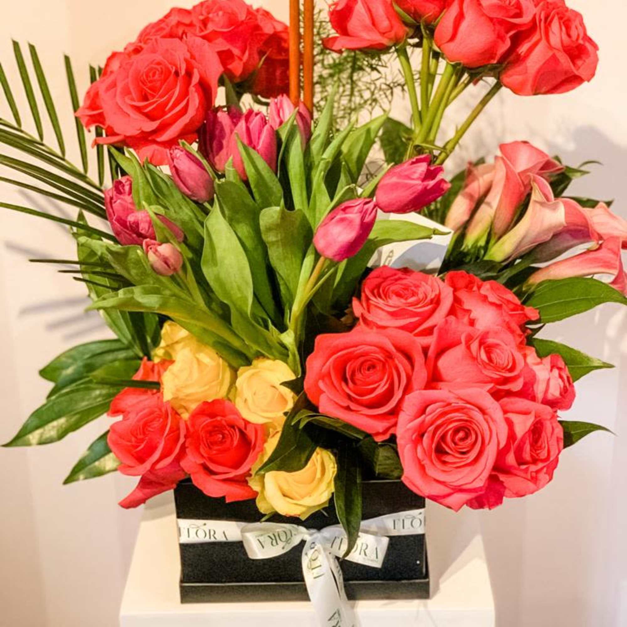 Charming small bloom box arrangement featuring a variety of fresh flowers. Perfect