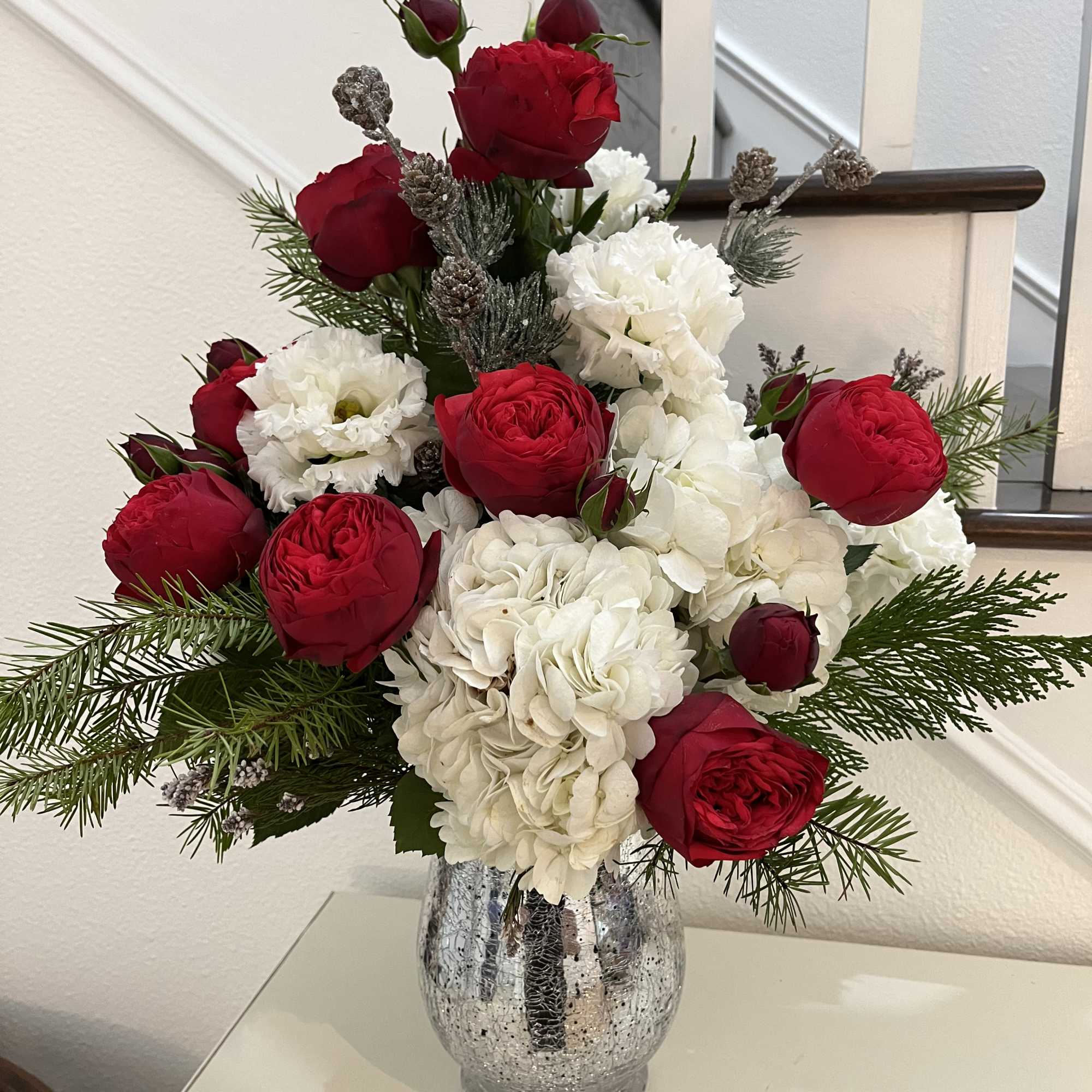 Red garden roses, hydrangea, lisianthus in a beautiful crackled silver vase pre