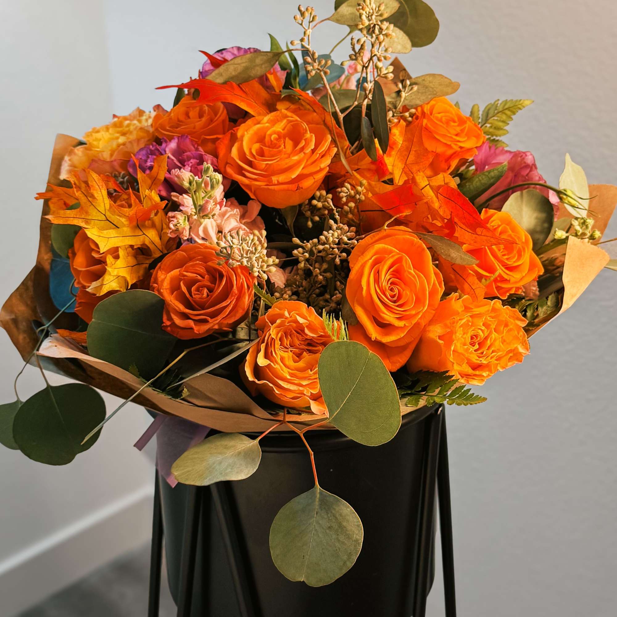 This fiery bouquet captures the essence of autumn with its vibrant orange This fiery bouquet captures the essence of autumn with its vibrant orange