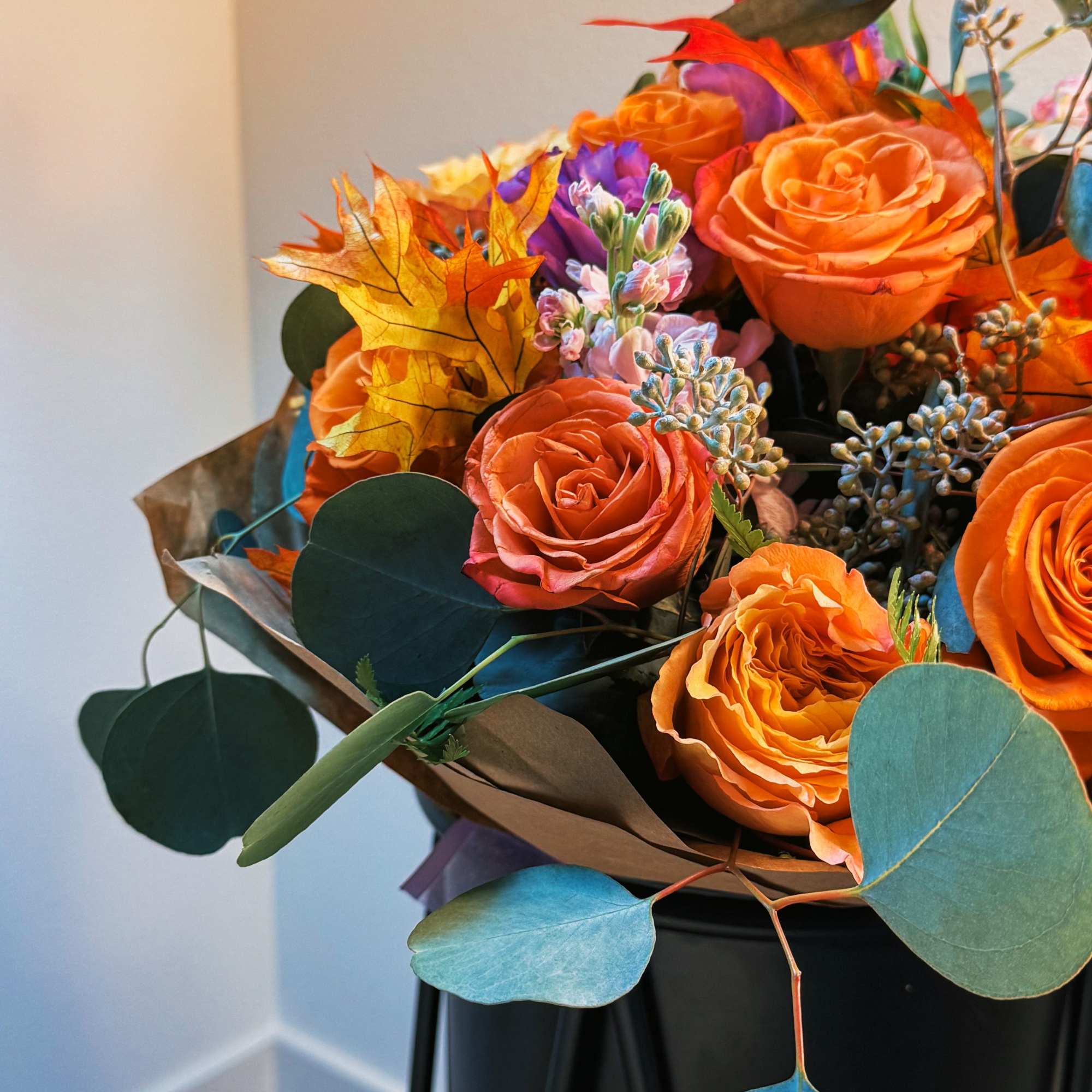 This fiery bouquet captures the essence of autumn with its vibrant orange This fiery bouquet captures the essence of autumn with its vibrant orange
