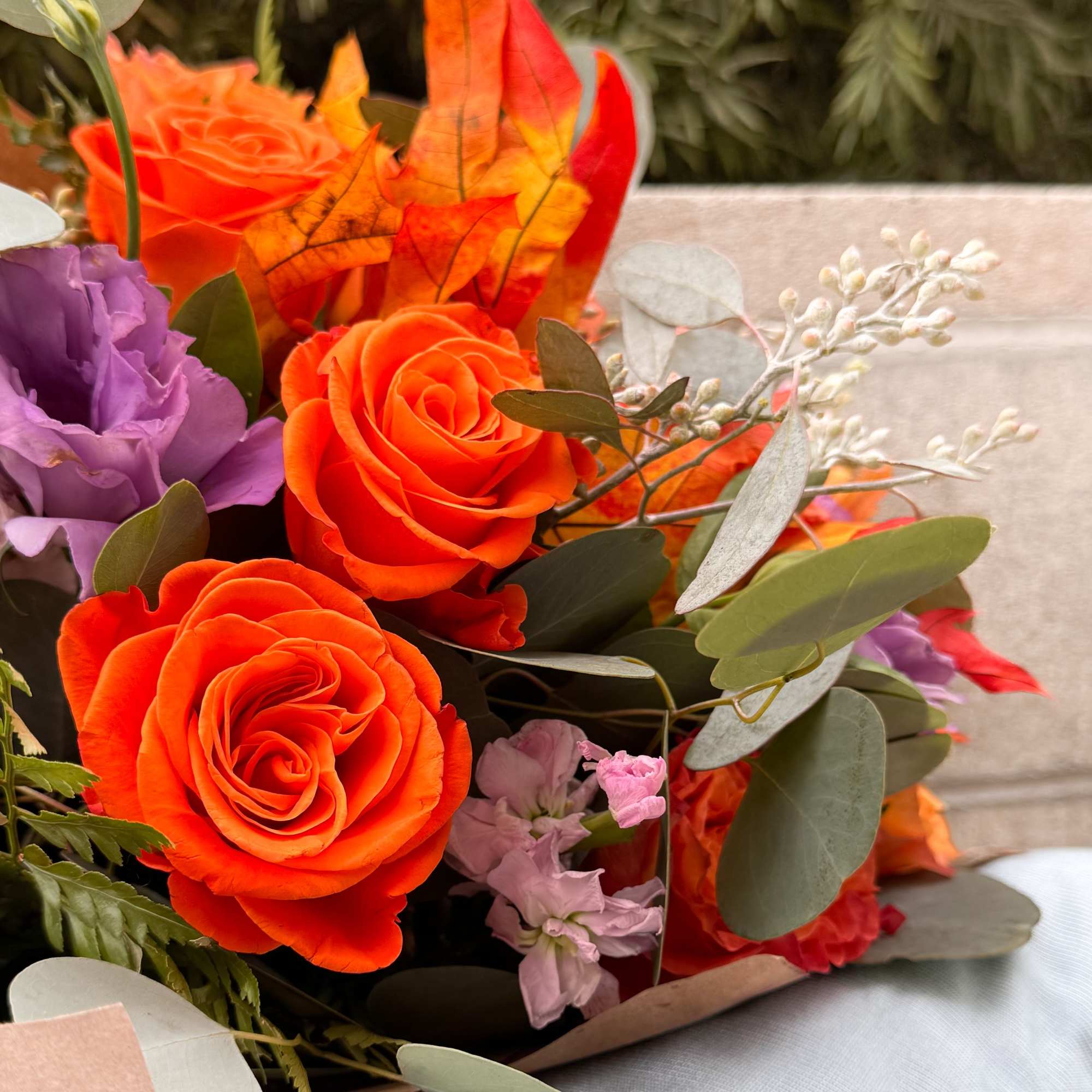 This fiery bouquet captures the essence of autumn with its vibrant orange This fiery bouquet captures the essence of autumn with its vibrant orange
