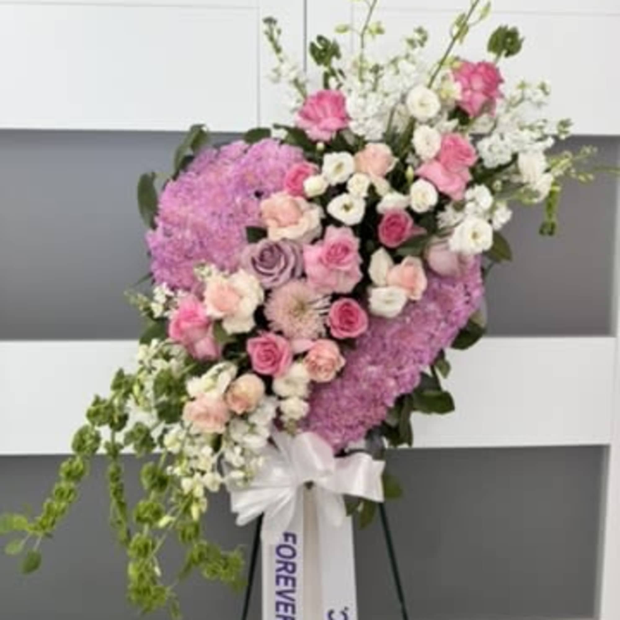 Express your deepest sympathy with our an artful statement piece. Our large