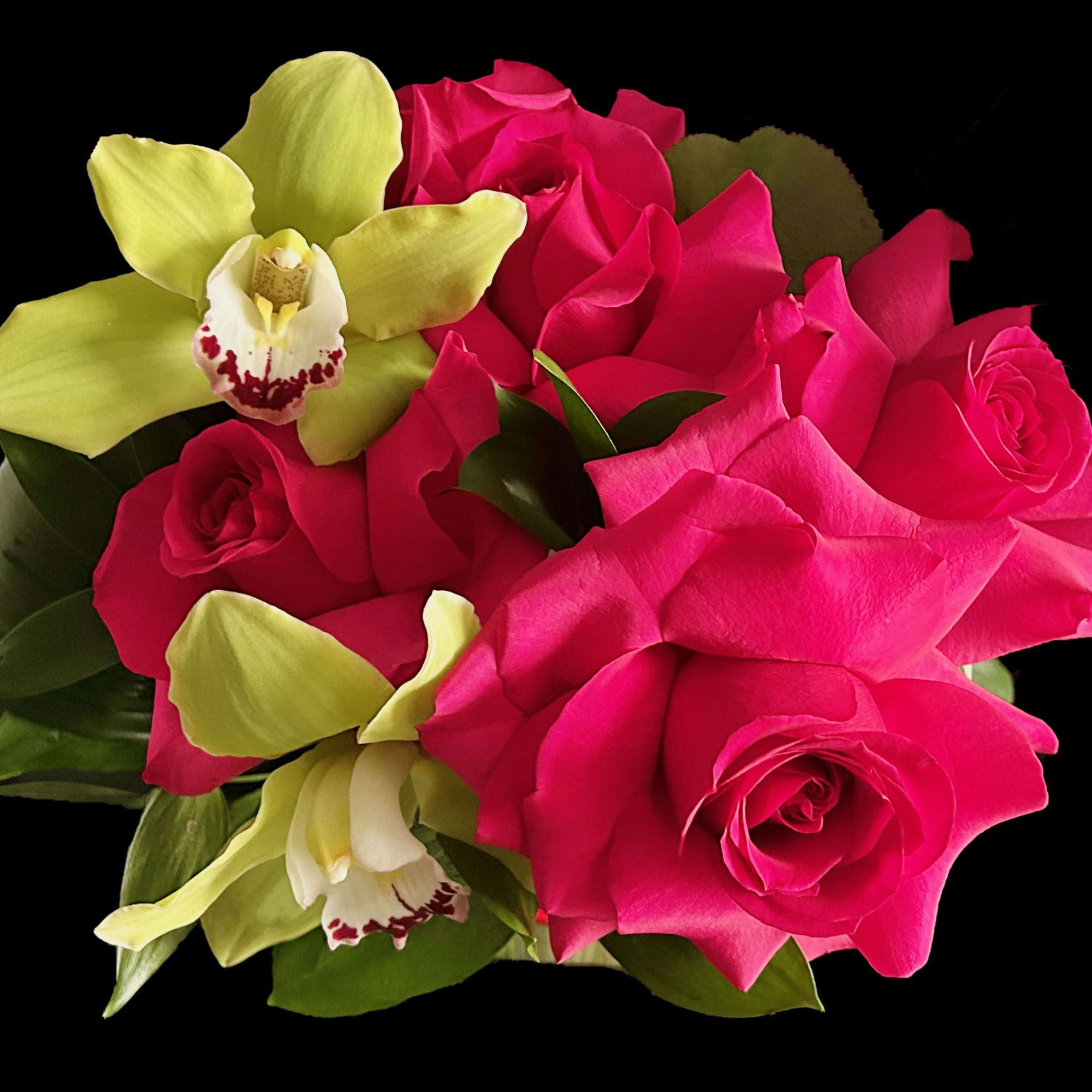 Bright roses and Orchids in lined glass cube.