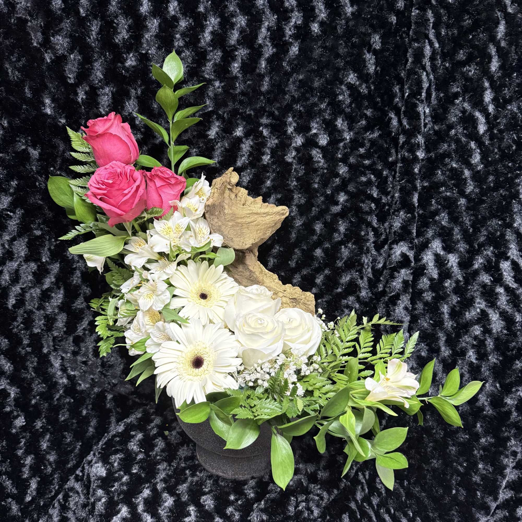 A serene and dreamy design. Soft roses rest around a golden trunk A serene and dreamy design. Soft roses rest around a golden trunk