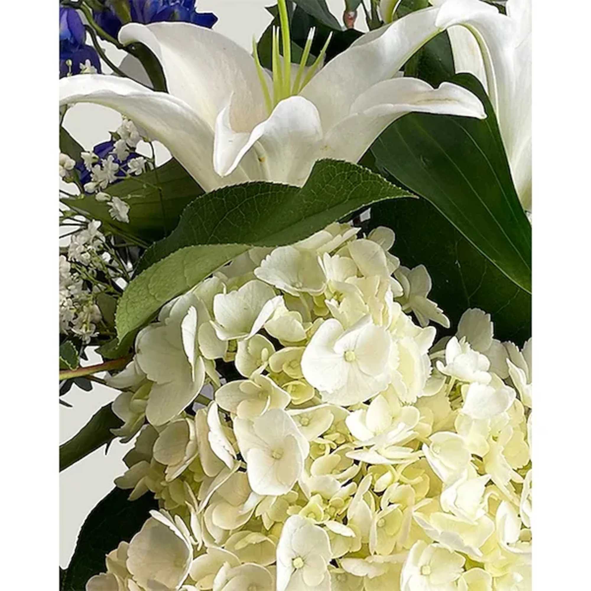 This lovely blue and white arrangement creates a statement to celebrate a This lovely blue and white arrangement creates a statement to celebrate a