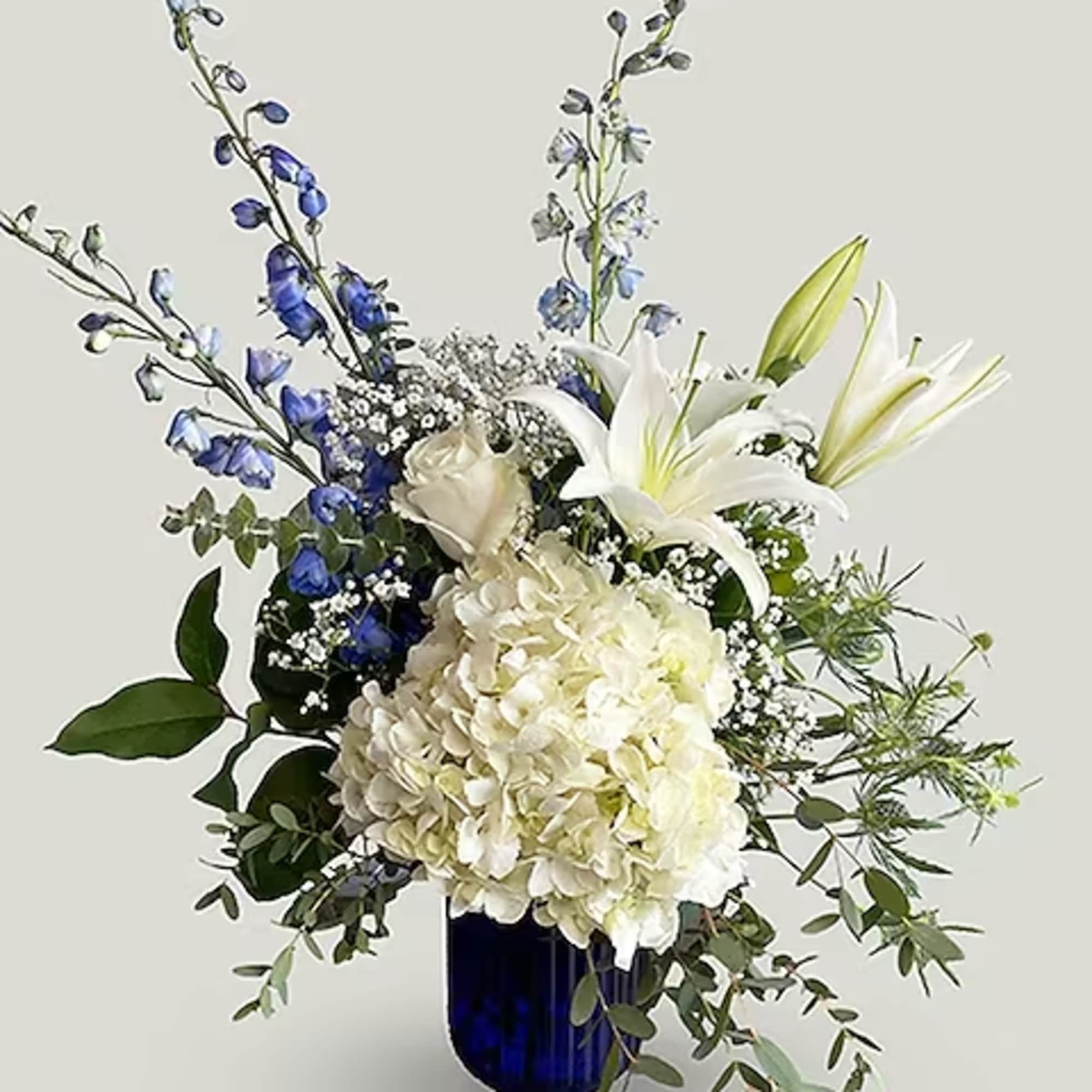 This lovely blue and white arrangement creates a statement to celebrate a This lovely blue and white arrangement creates a statement to celebrate a