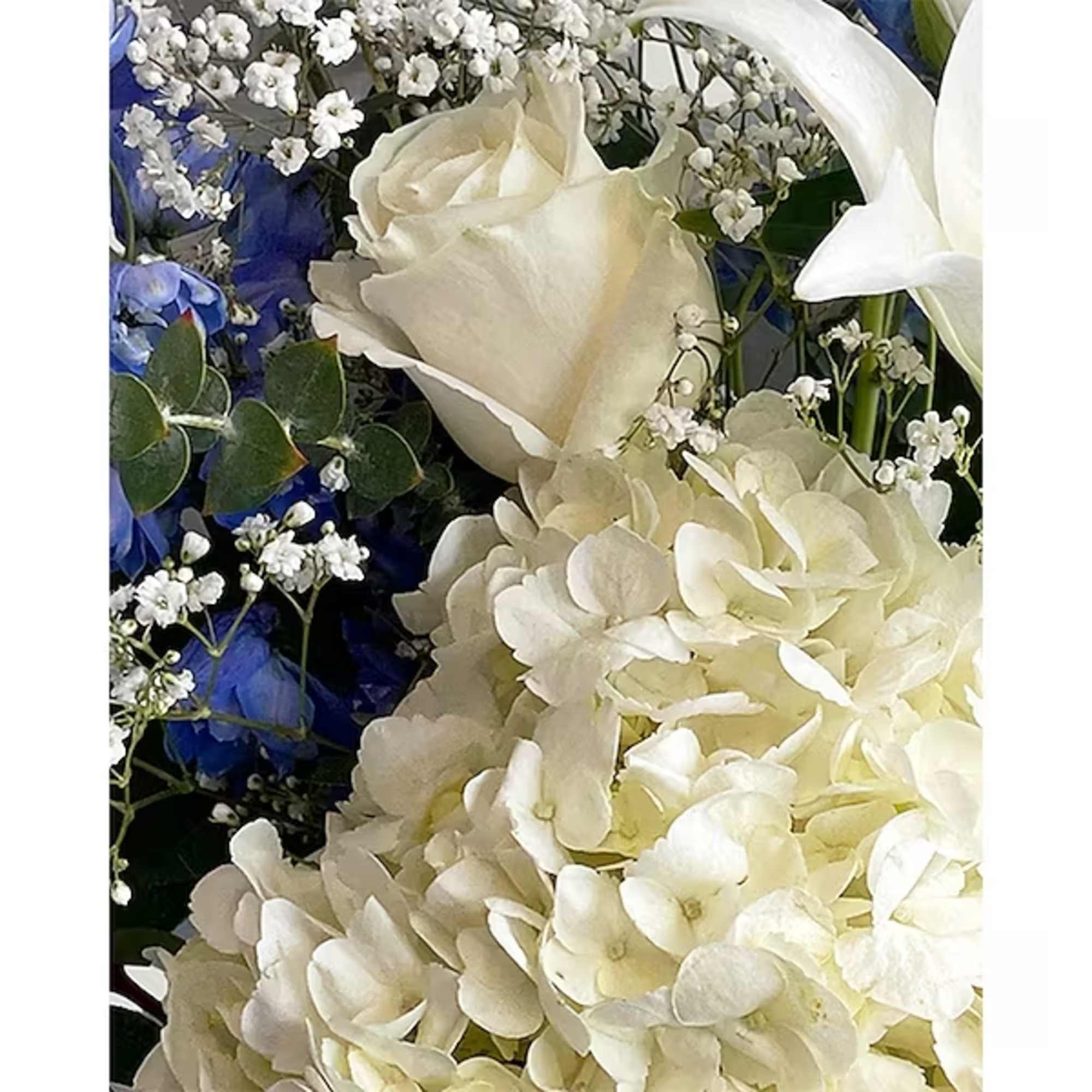 This lovely blue and white arrangement creates a statement to celebrate a This lovely blue and white arrangement creates a statement to celebrate a