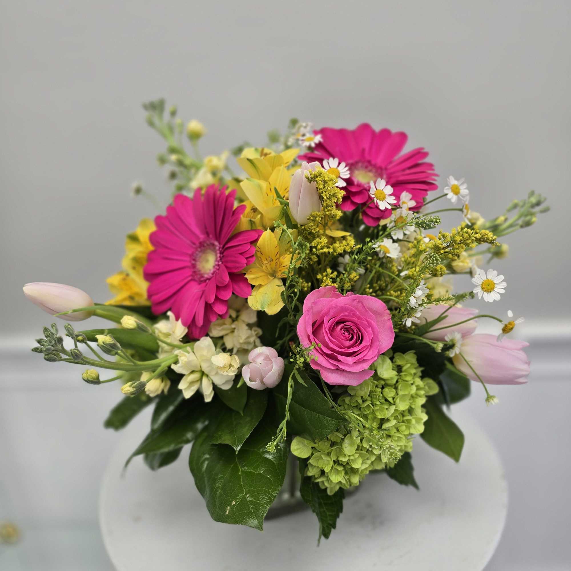 Send some sunshine with a beautiful spring arrangement!
*Container and Flowers may differ Send some sunshine with a beautiful spring arrangement!
*Container and Flowers may differ