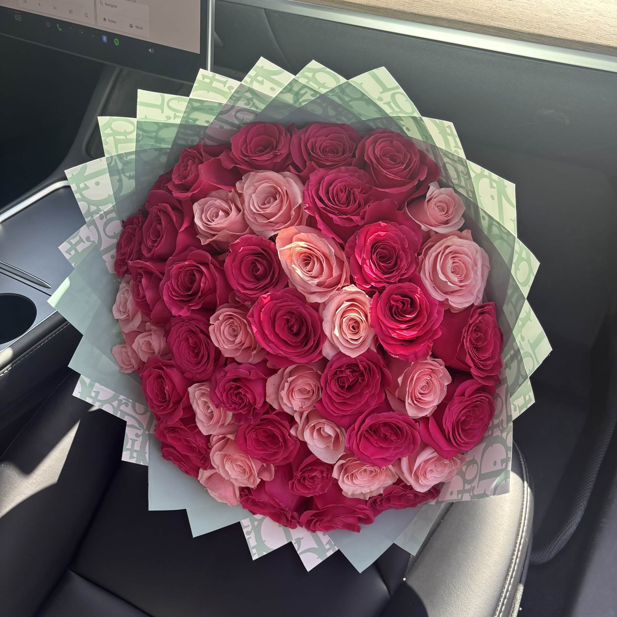 A luxurious Designer wrap in the color teal, with beautiful bright pinks A luxurious Designer wrap in the color teal, with beautiful bright pinks