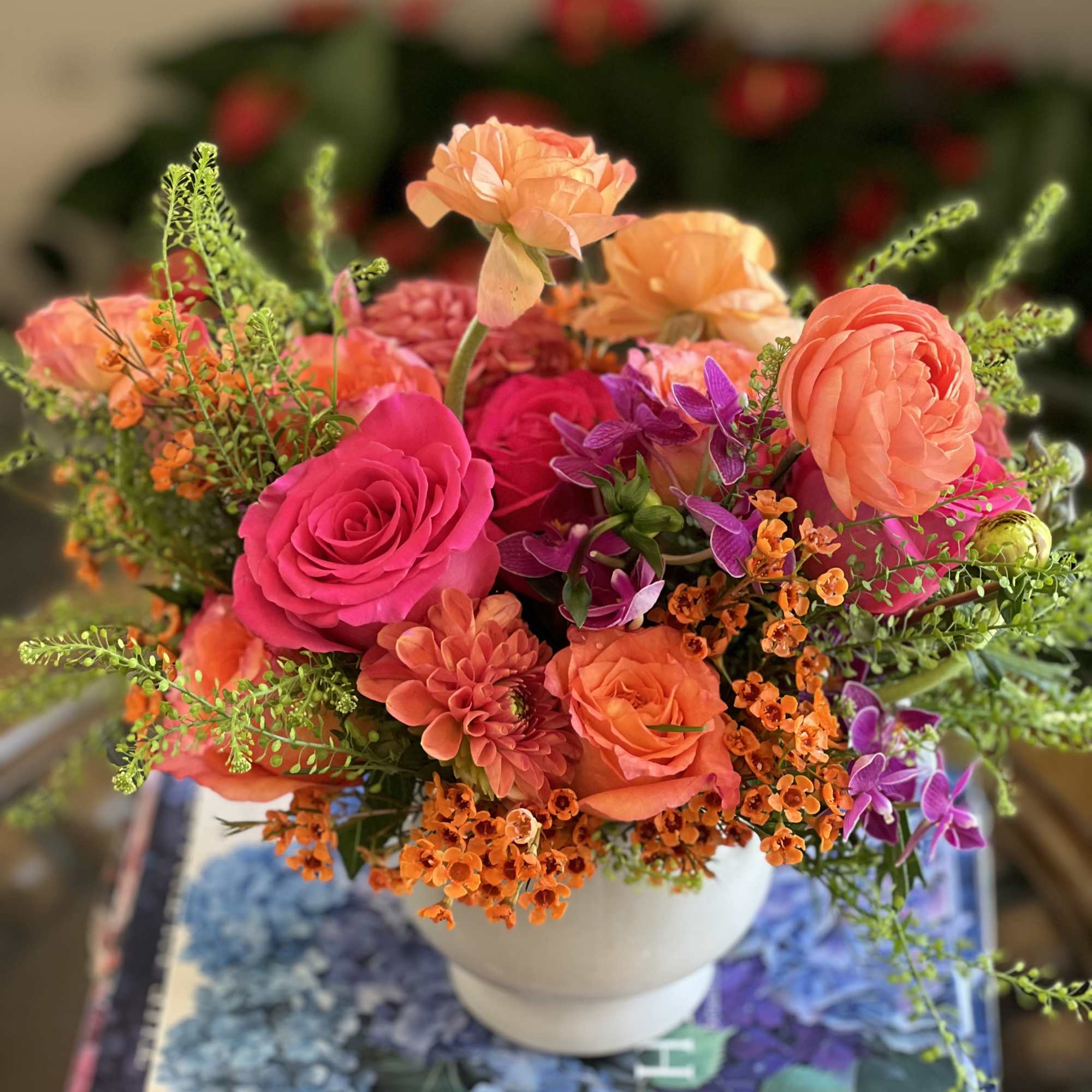 Flowers: free spirit roses, orange dahlias, orange waxflower, hot pink roses, green Flowers: free spirit roses, orange dahlias, orange waxflower, hot pink roses, green