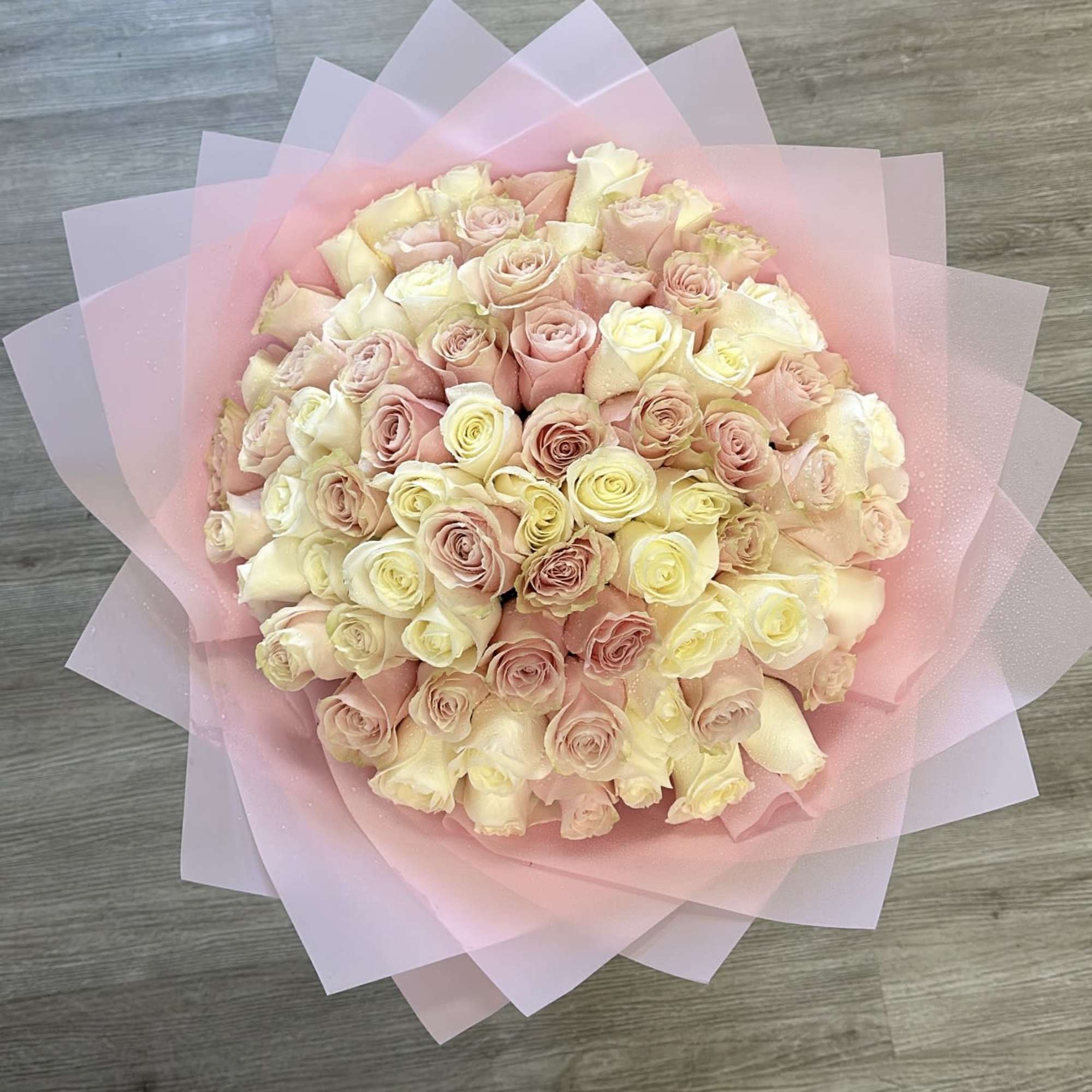 Delight in the soft, romantic beauty of our "Blushing Petals" bouquet. This