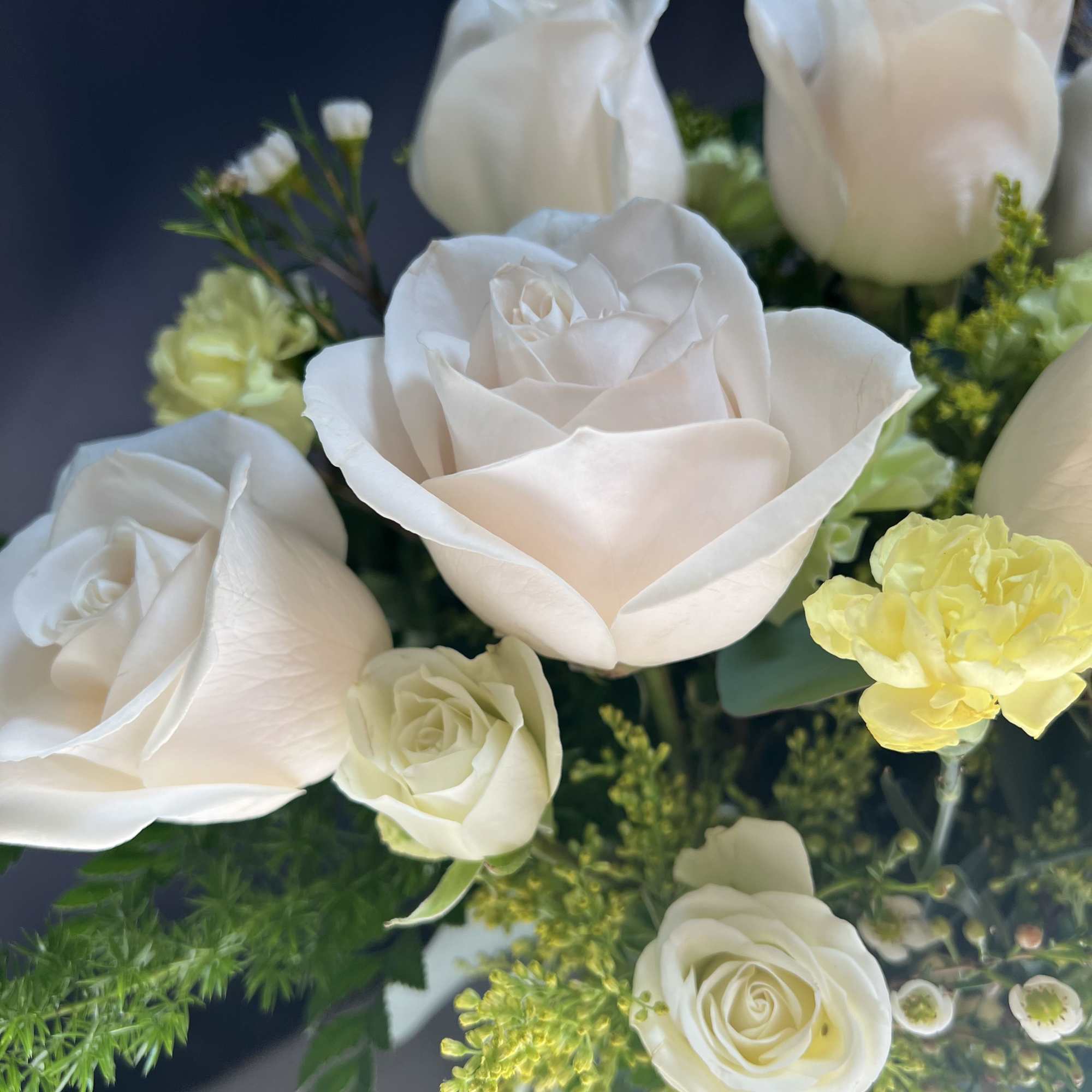 An off white rose and yellow filler flowers  is a great An off white rose and yellow filler flowers  is a great