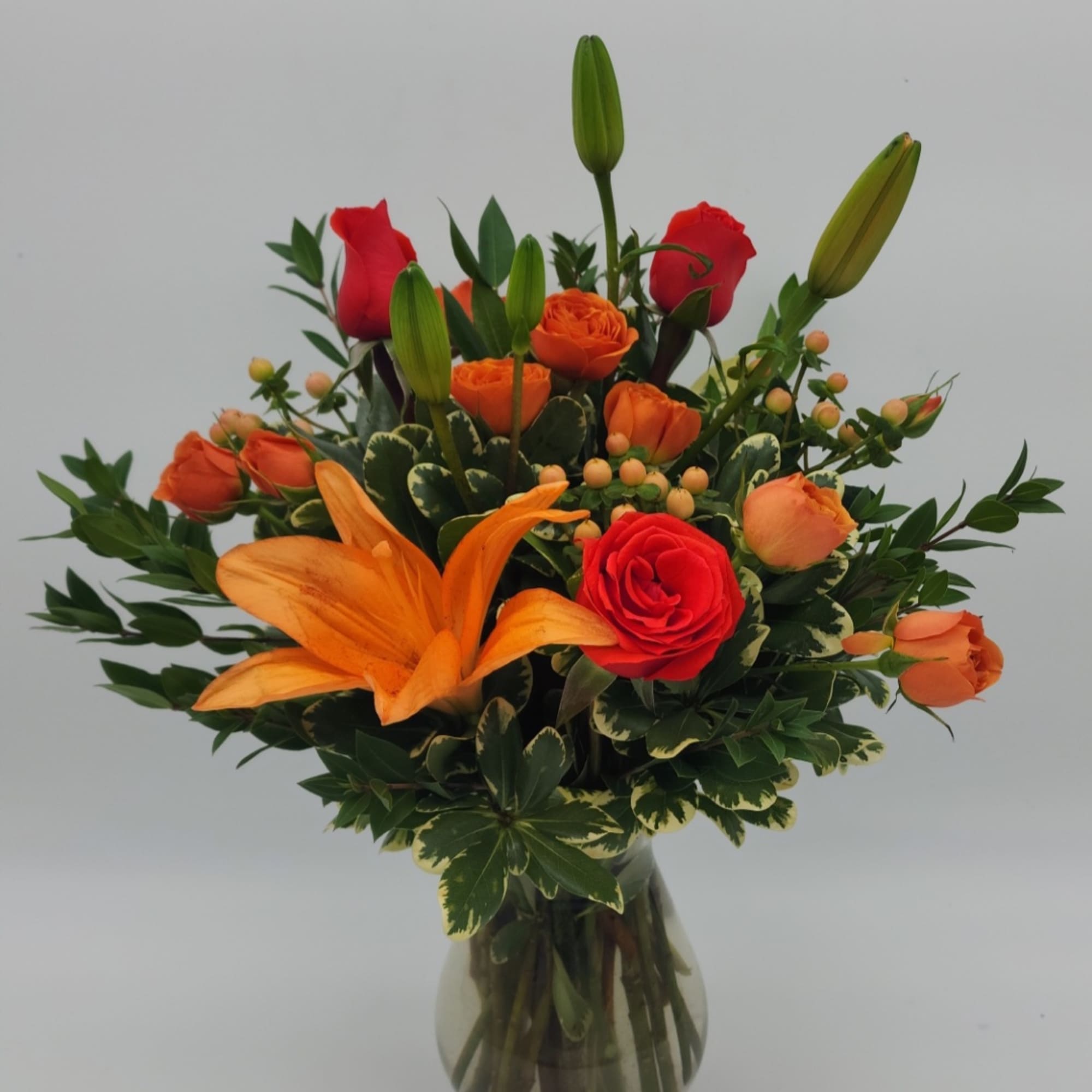 - Lilies - Spray Roses - Snapdragons - Hypericum Berries - Alstroemeria